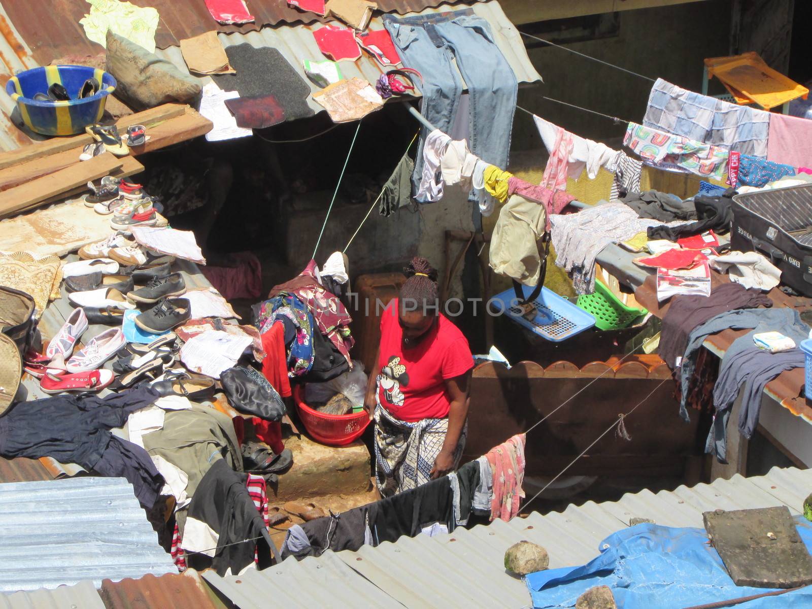 SIERRA LEONE, Freetown: Severe flooding that hit Freetown, Sierra Leone this week has left four people dead and is posing a serious risk of Ebola spreading. Residents at Congo Cross Bridge worked to dry out their homes and contain the spread of the disease on September 17, 2015. 