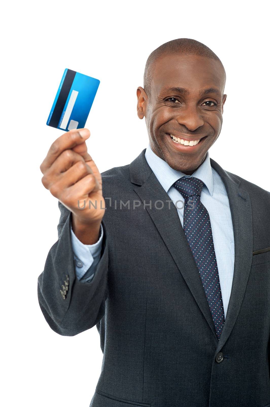 Smiling businessman showing his credit card