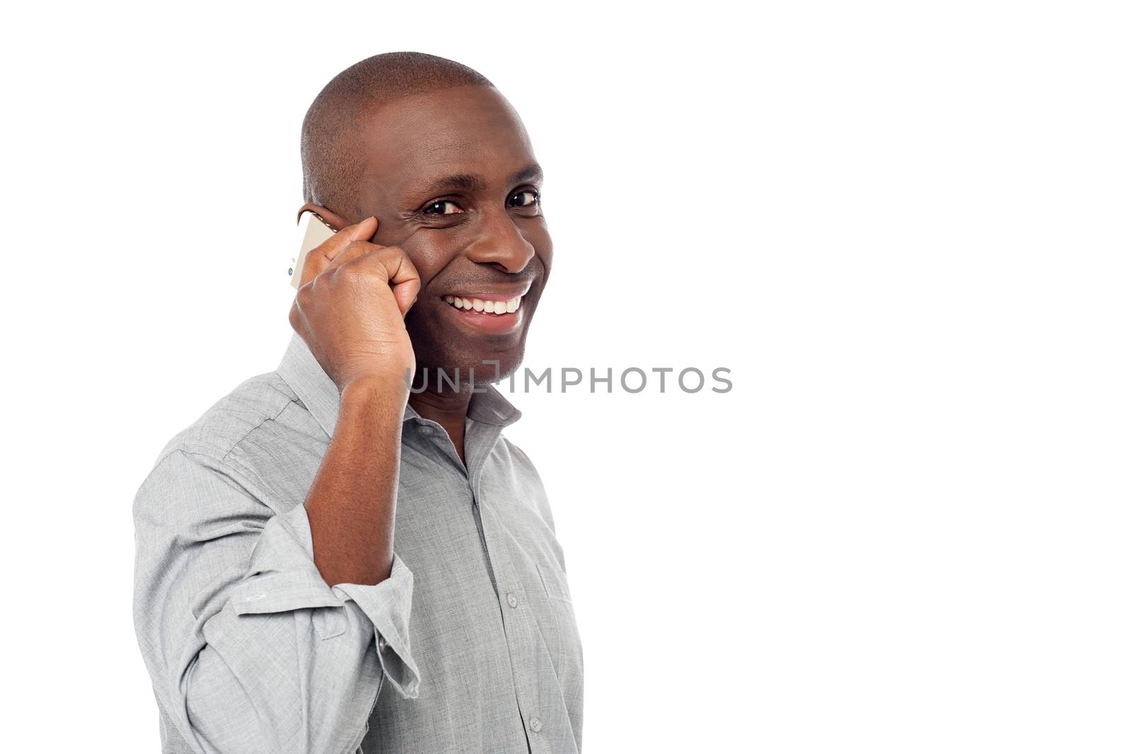 Sideways casual man talking on cell phone