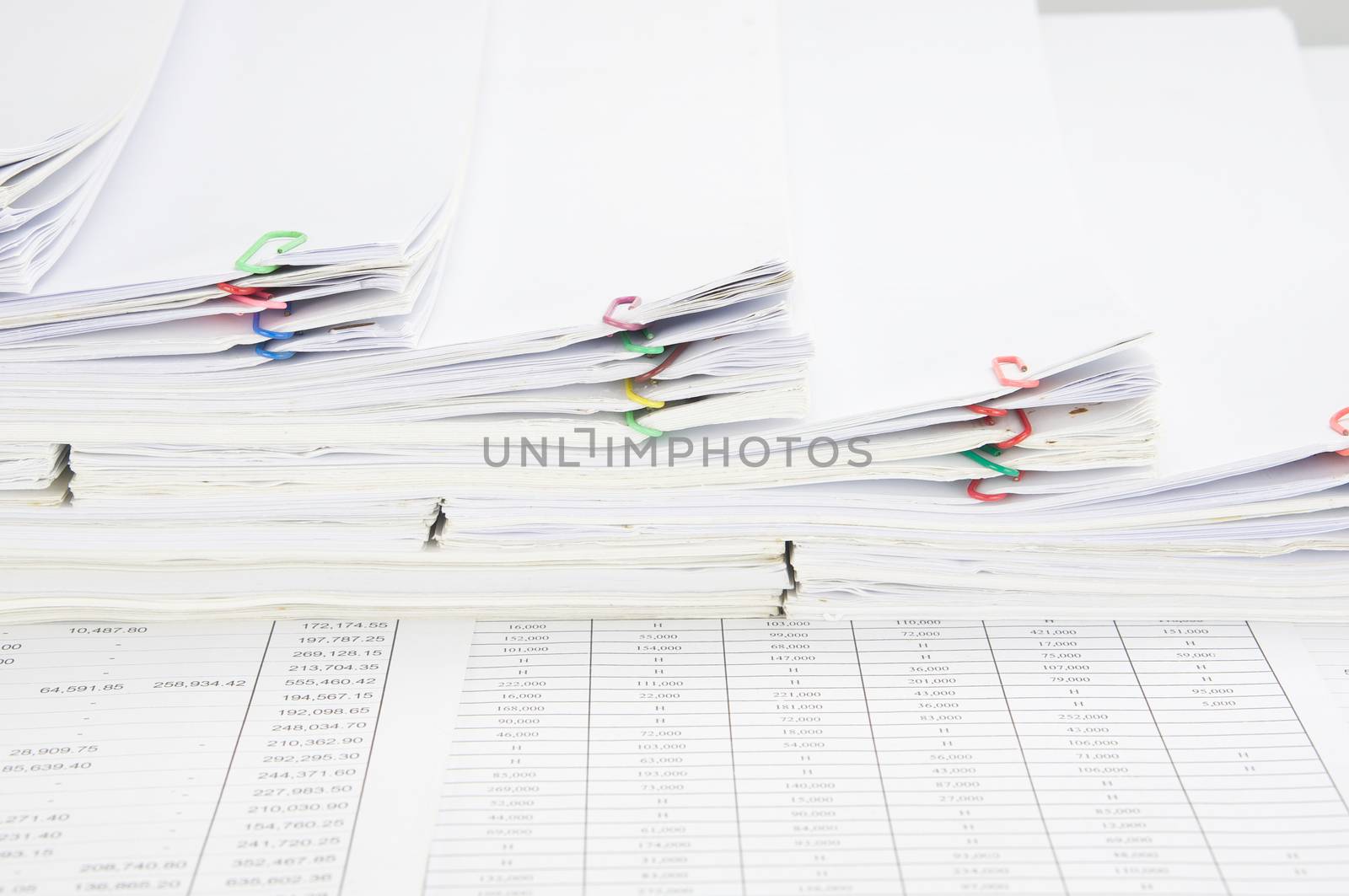 Step pile of paperwork and paper of report on finance account.