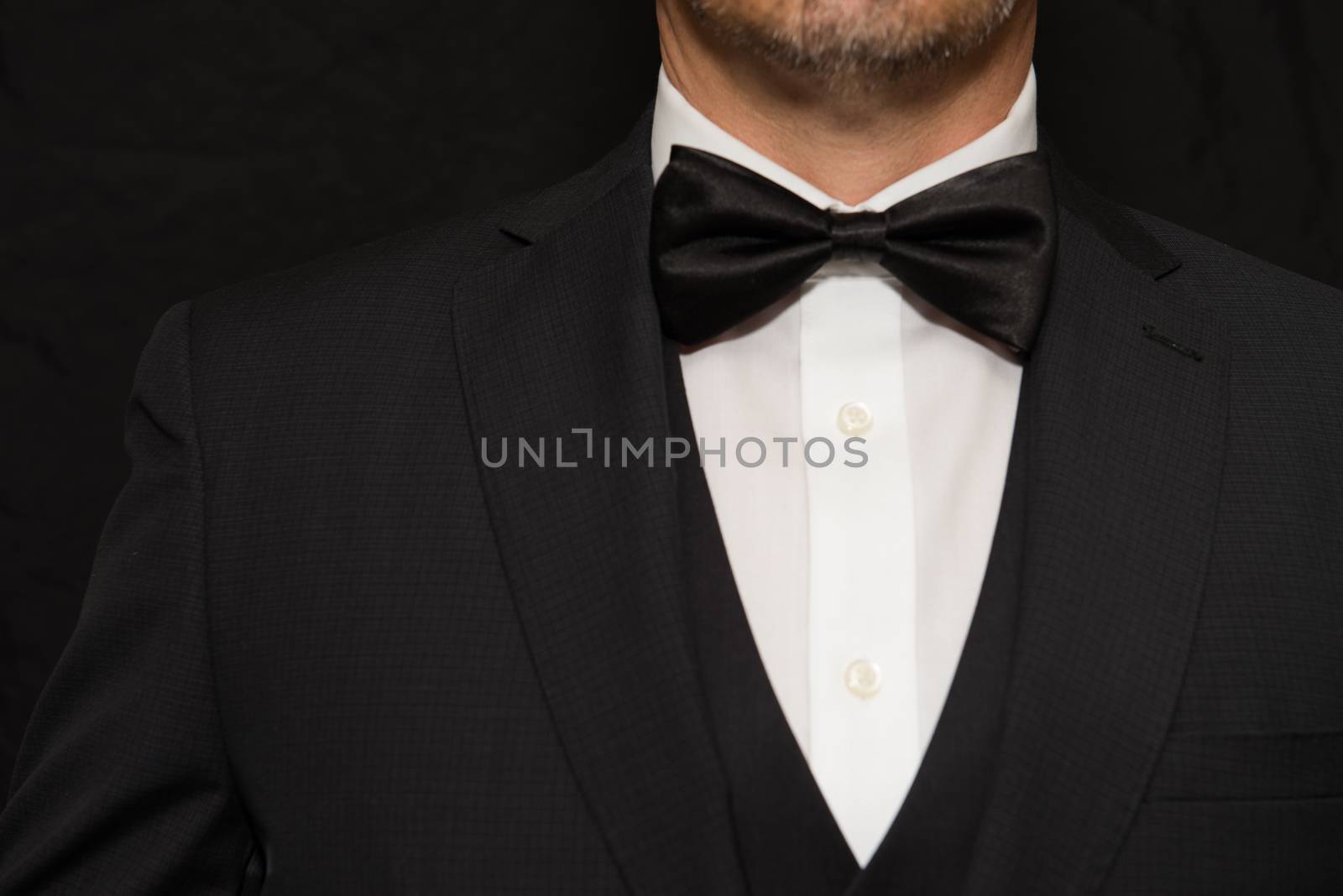 Close-up of a gentleman wearing Black Tie.