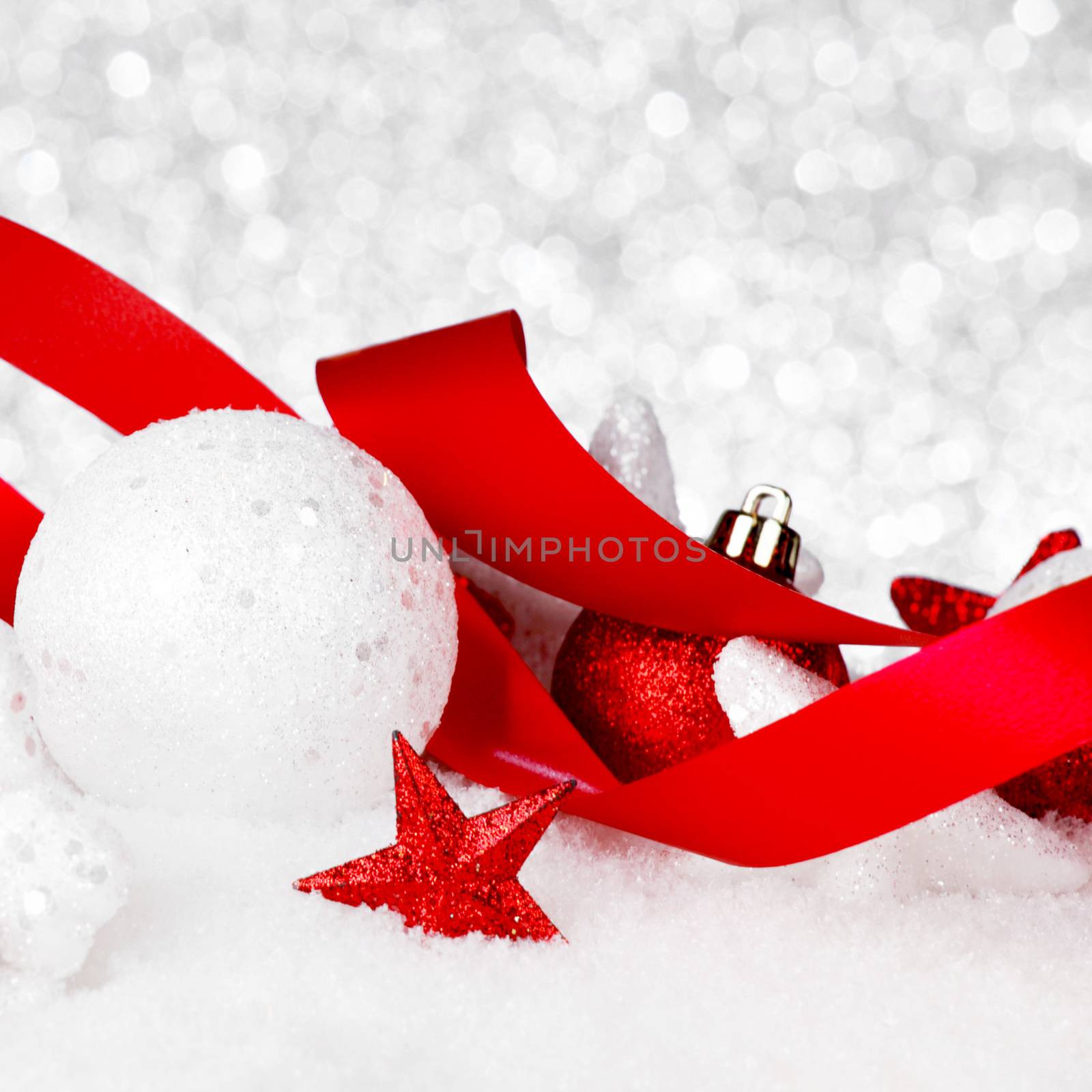 Christmas card with beautiful decorations in snow with silver background