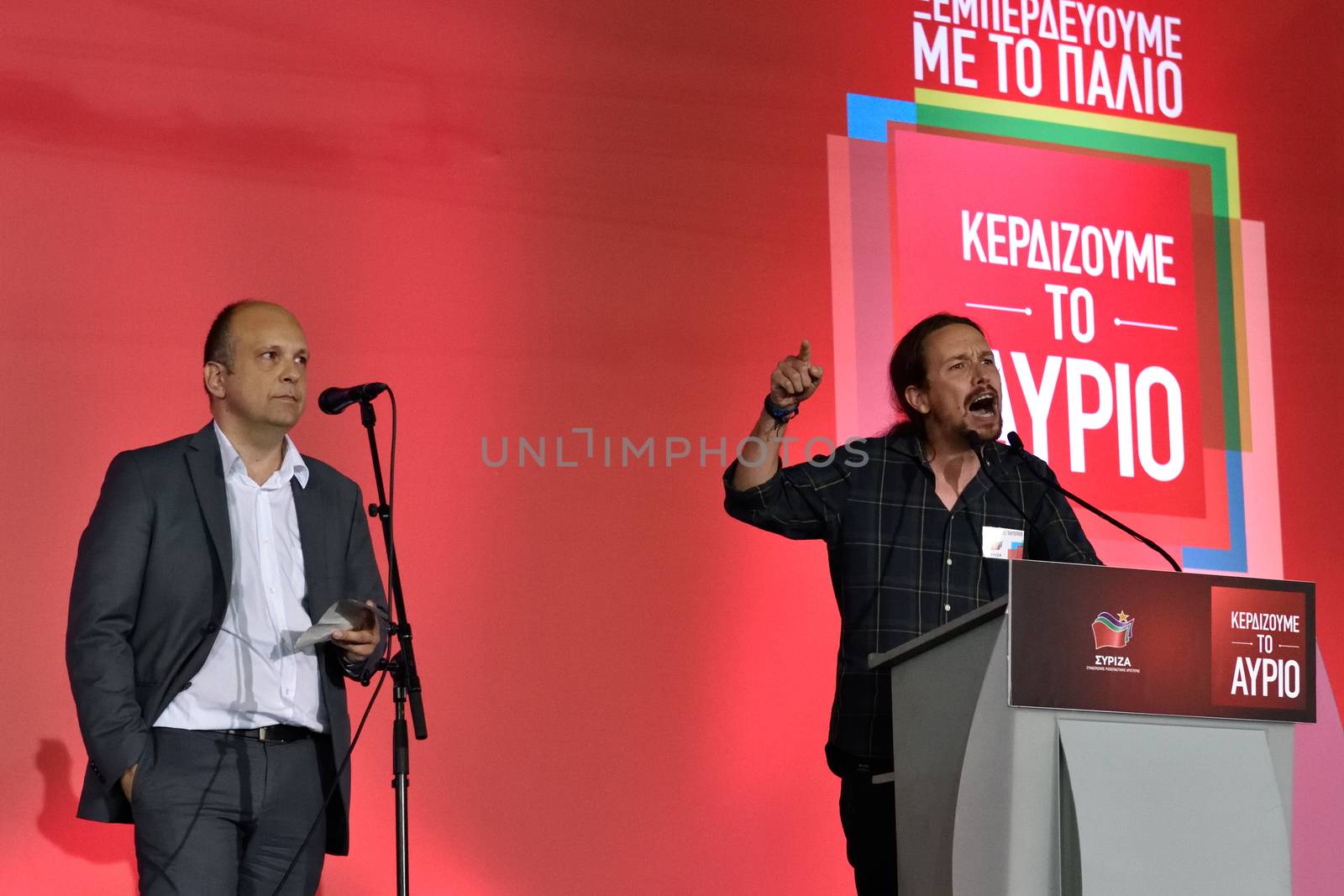 GREECE, Athens: Pablo Iglesias (R) of the Spanish anti-austerity Podemos party speaks to Syriza party supporters during the party's main election campaign rally in Athens, Greece on September 18, 2015. The Greek General Election will be held on September 20