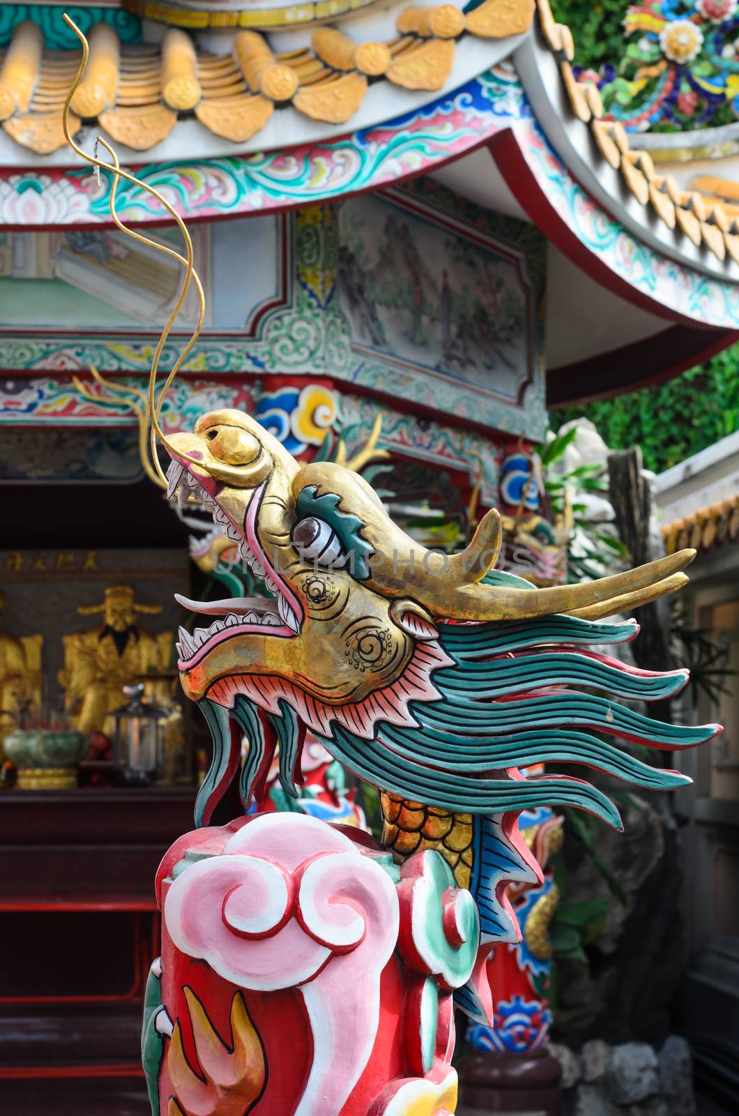 China Dragon statue in china temple roof shot  the beautiful reflected light.