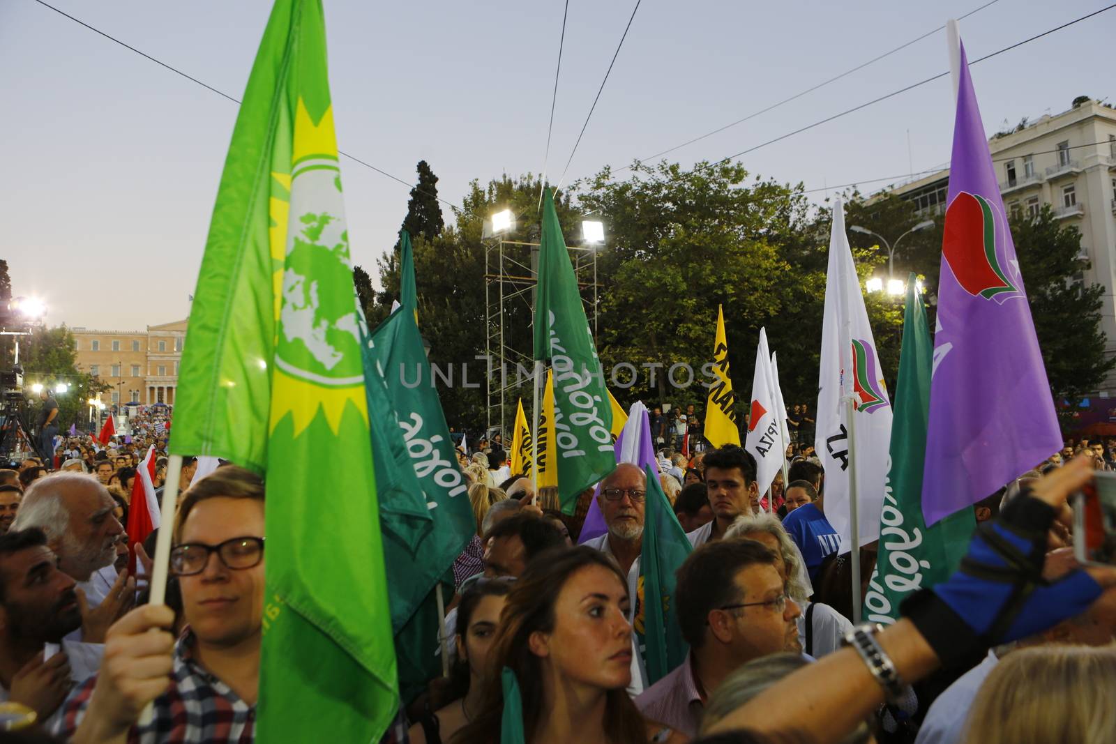 GREECE, Athens: Syriza supporters waving flags march on Syntagma Square for the party's final election rally in Athens on September 18, 2015 two days ahead of the Greek General Election