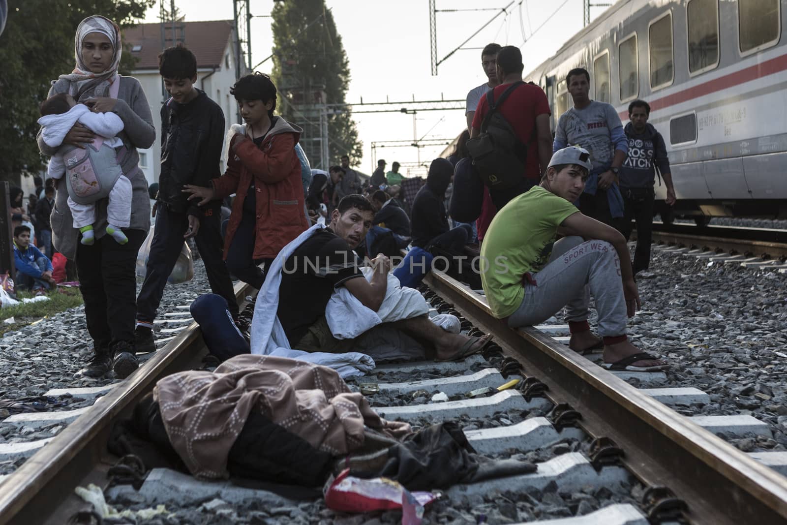CROATIA, Tovarnik: Refugees sit and wait at the railway station in Tovarnik, Croatia near the Serbian-border on September 18, 2015. Refugees are hoping to continue their journey to Germany and Northern Europe via Slovenia 