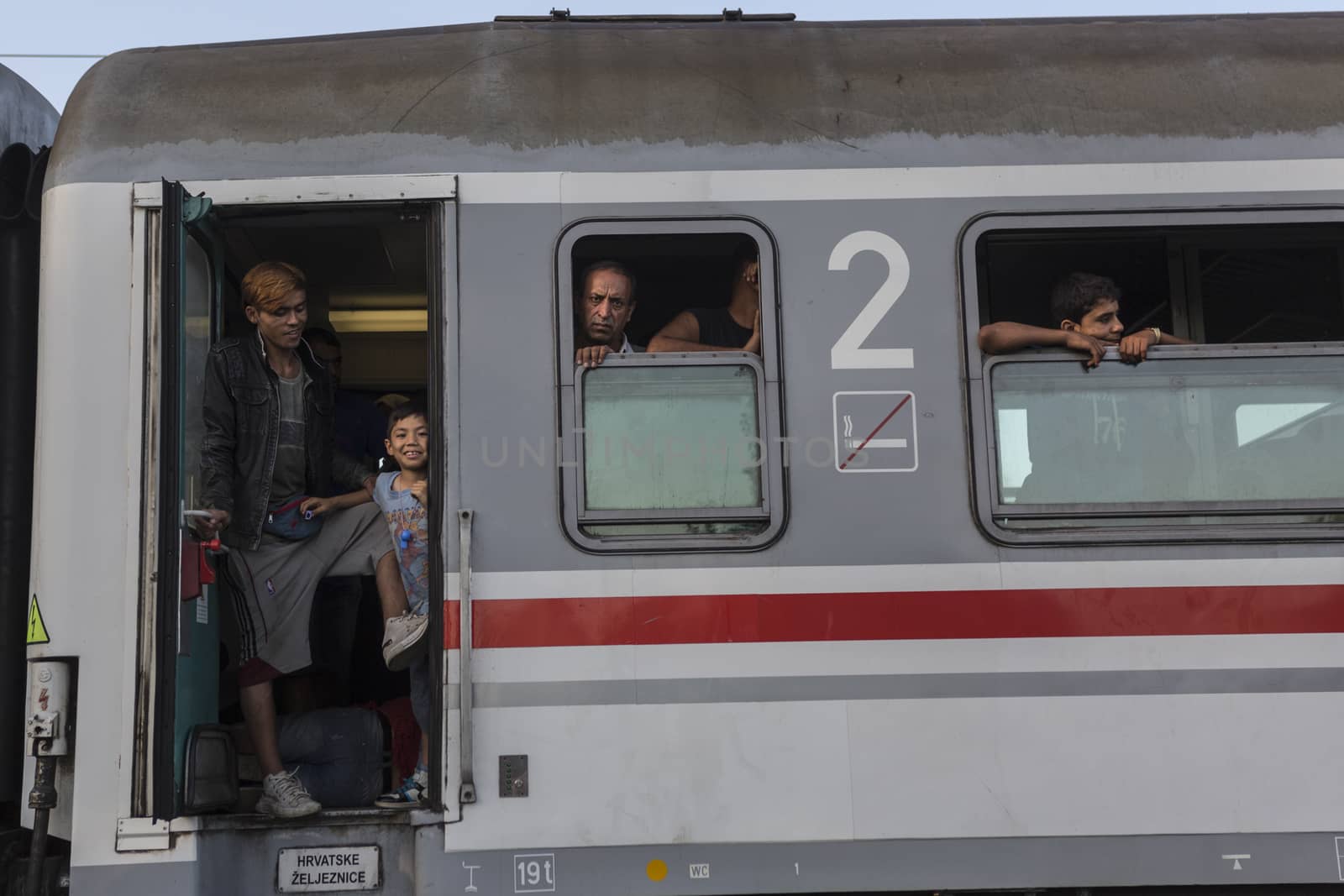 CROATIA, Tovarnik: Refugees board a train at the railway station in Tovarnik, Croatia near the Serbian-border on September 18, 2015. Refugees are hoping to continue their journey to Germany and Northern Europe via Slovenia 