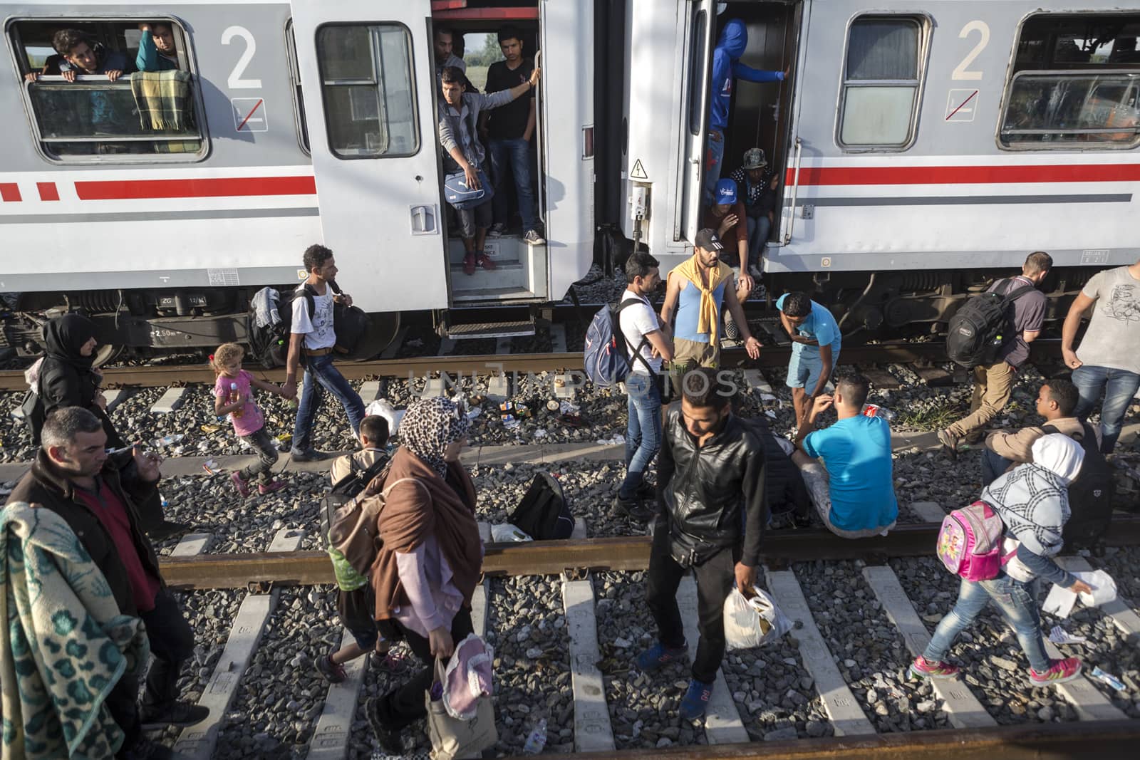 CROATIA, Tovarnik: Refugees line up and wait at the railway station in Tovarnik, Croatia near the Serbian-border on September 18, 2015. Refugees are hoping to continue their journey to Germany and Northern Europe via Slovenia 