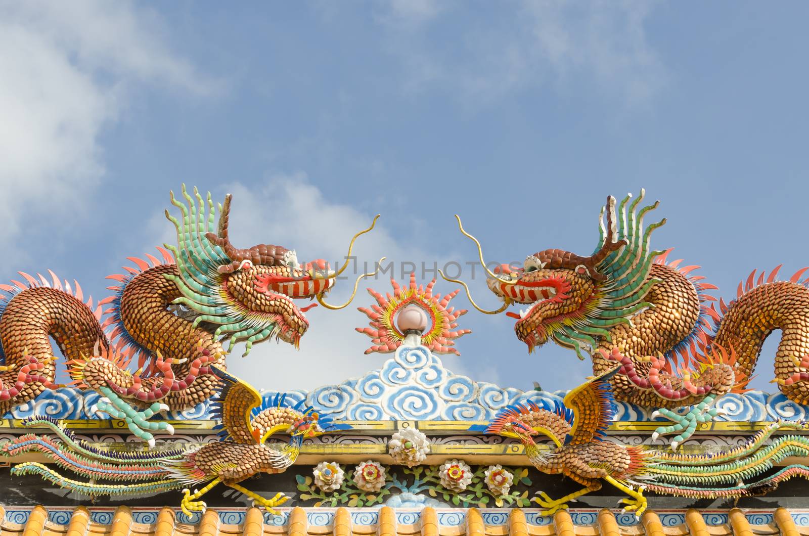 Various color dragons on blue sky , a city is Chon buri , Thailand