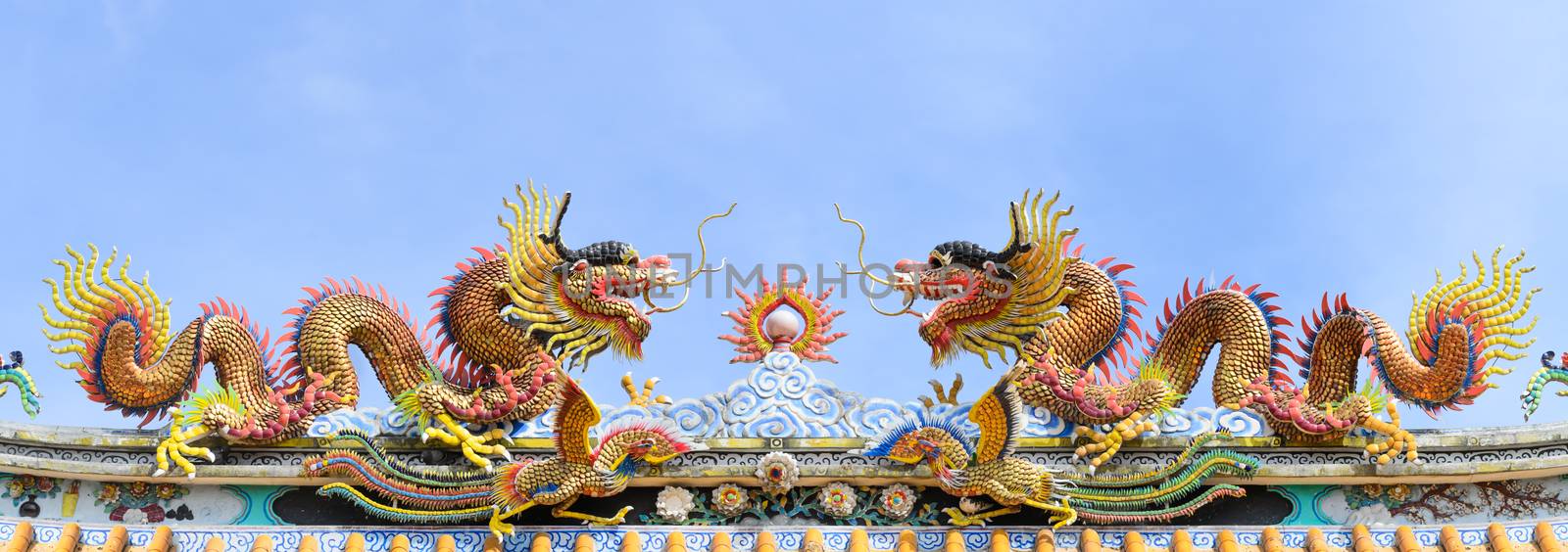 Various color dragons on blue sky , a city is Chon buri , Thailand