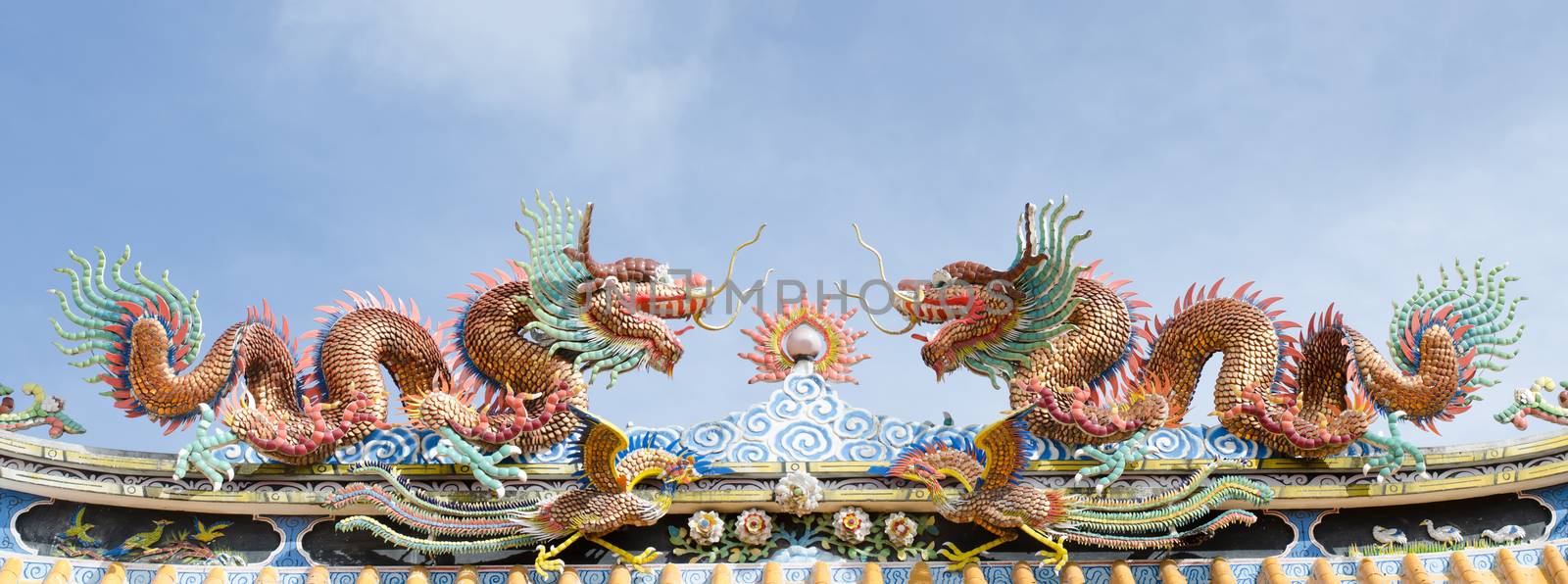 Various color dragons on blue sky , a city is Chon buri , Thailand