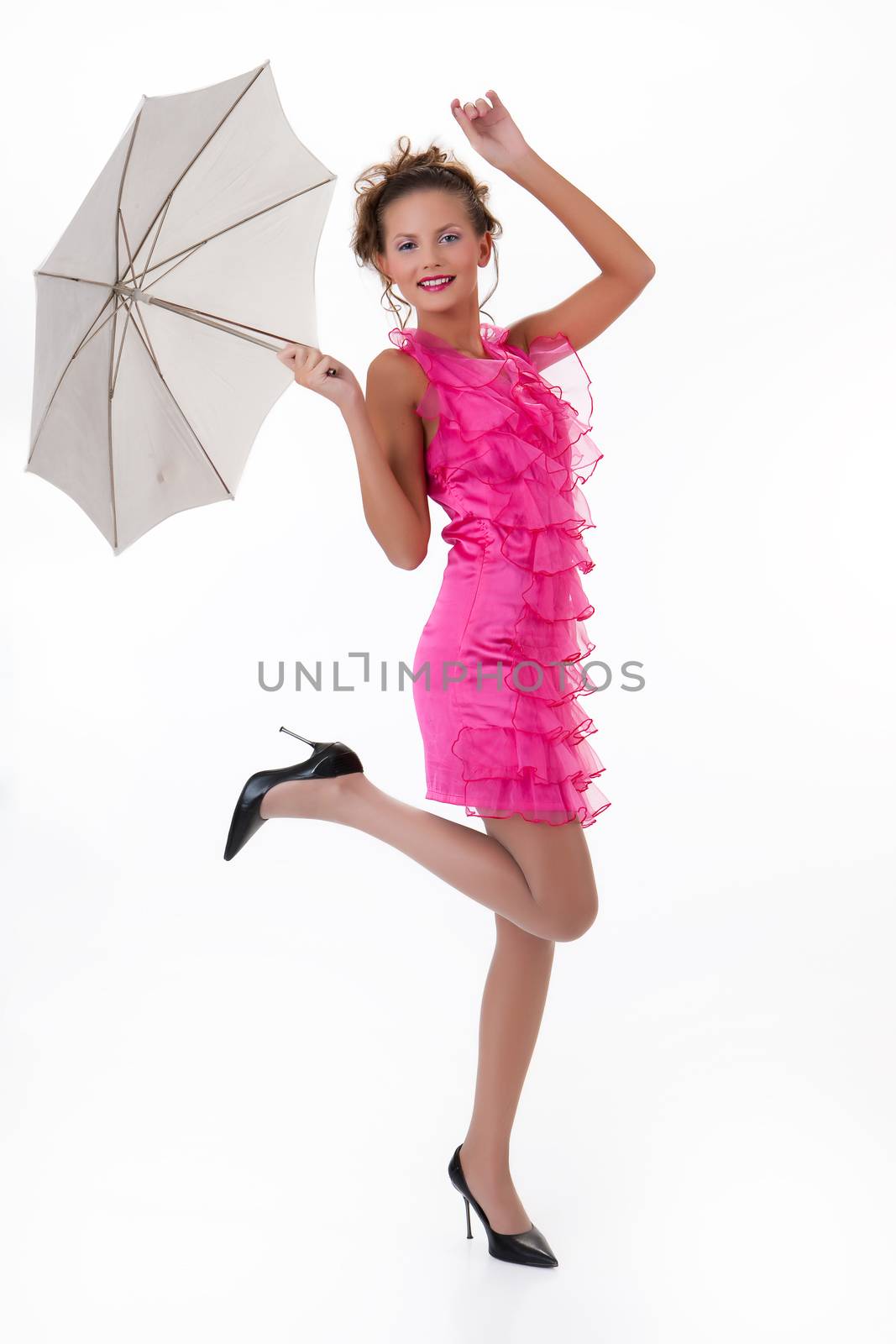 Young beautiful woman with umbrella on isolated studio background