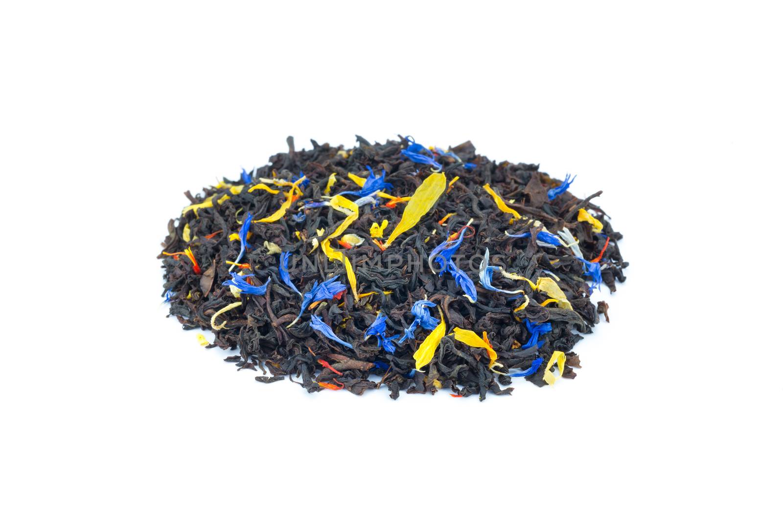 Heap of colorful loose exotic dream tea on white background