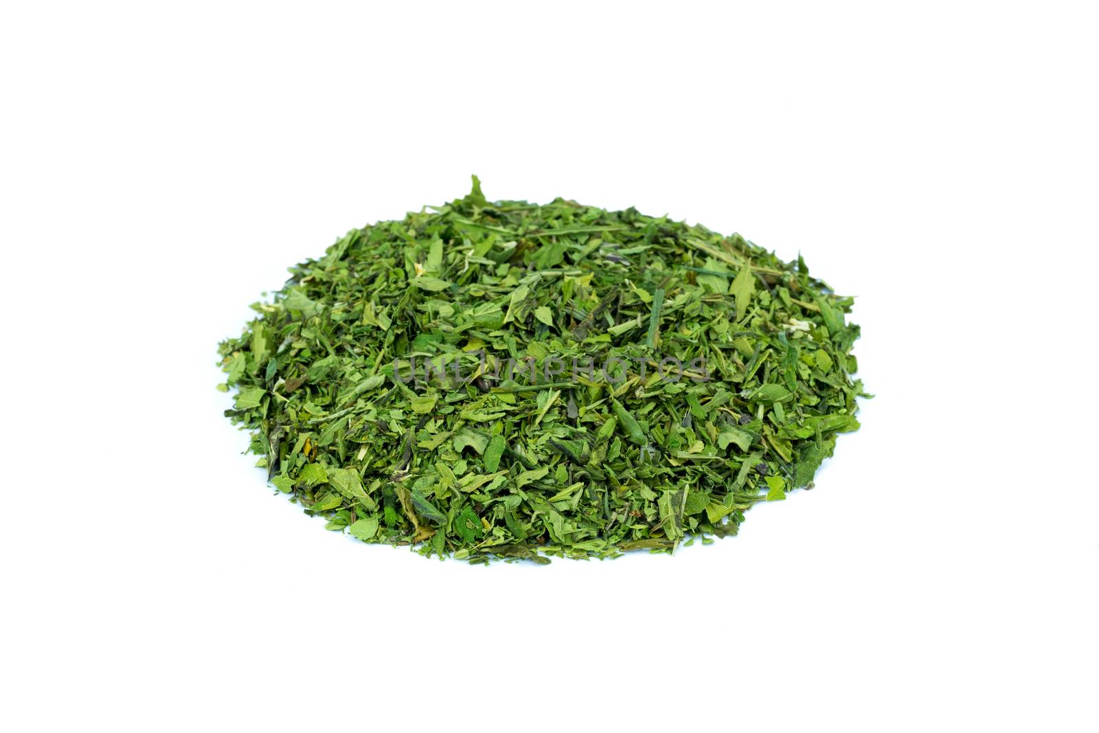 Heap of green hemp tea on white background by BenSchonewille