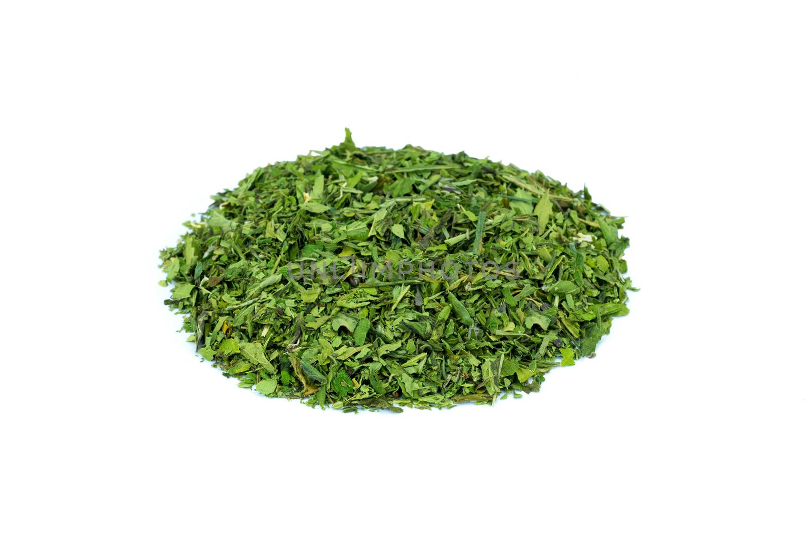 Heap of green hemp tea isolated on white background