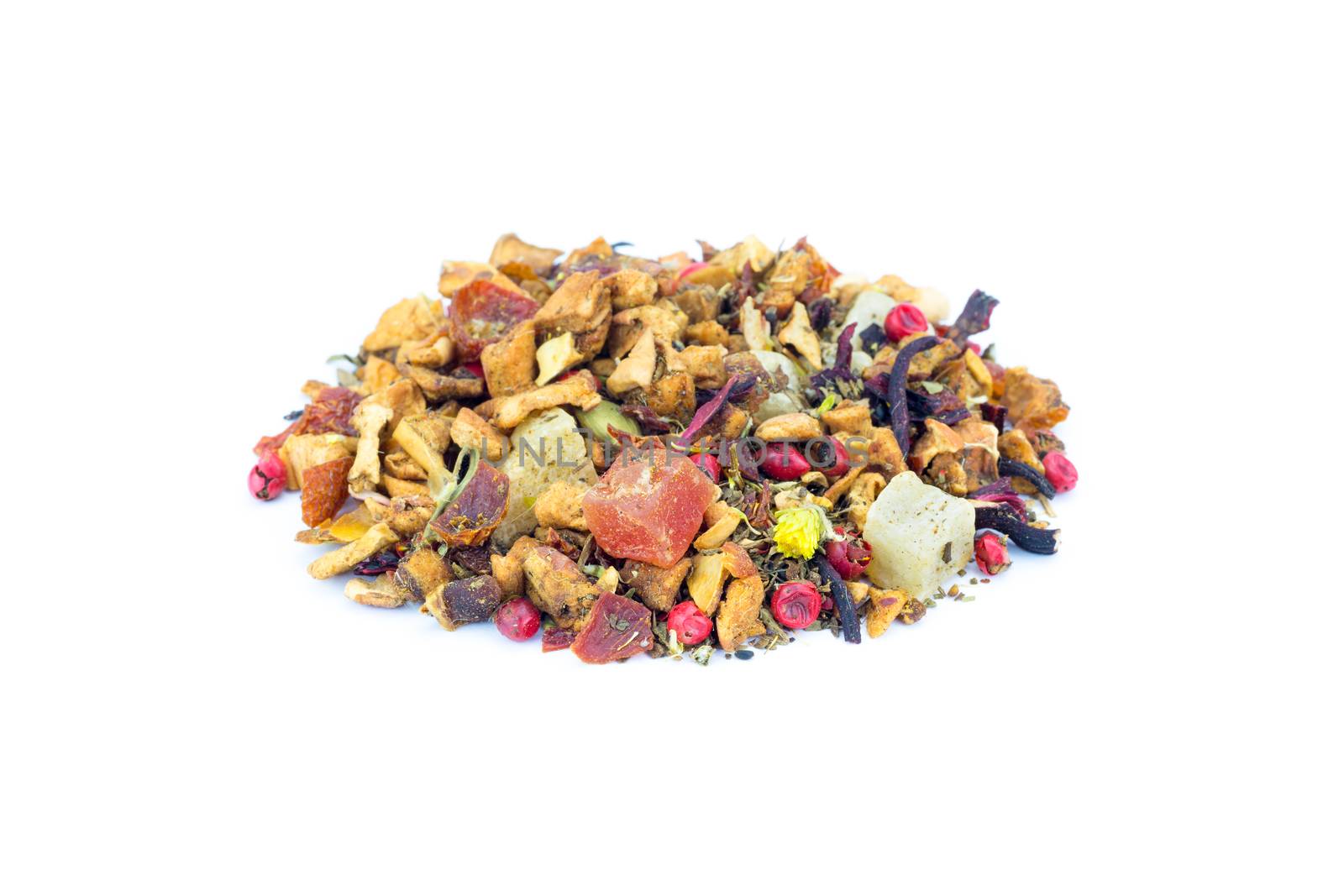 Heap of colorful loose hot pineapple tea on white by BenSchonewille
