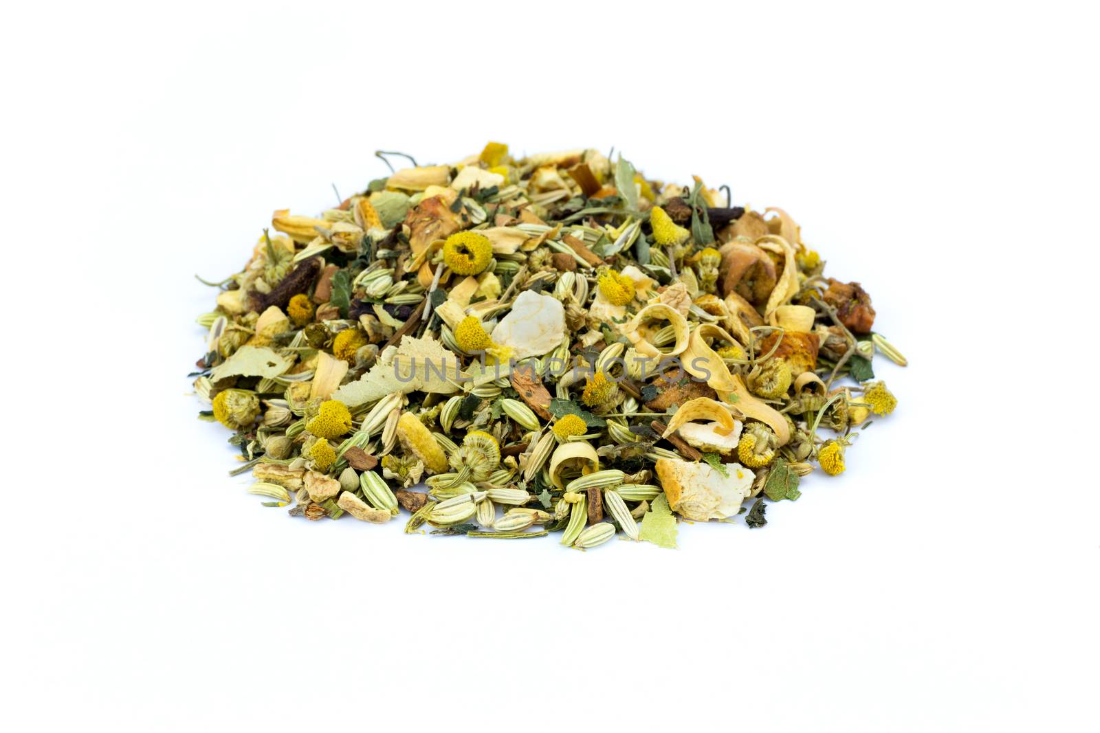 Heap of loose mixture of herbal tea isolated on white background