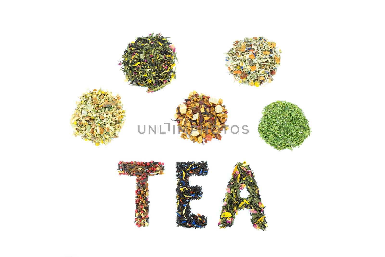 Word TEA with letters made of different tea species isolated on white background