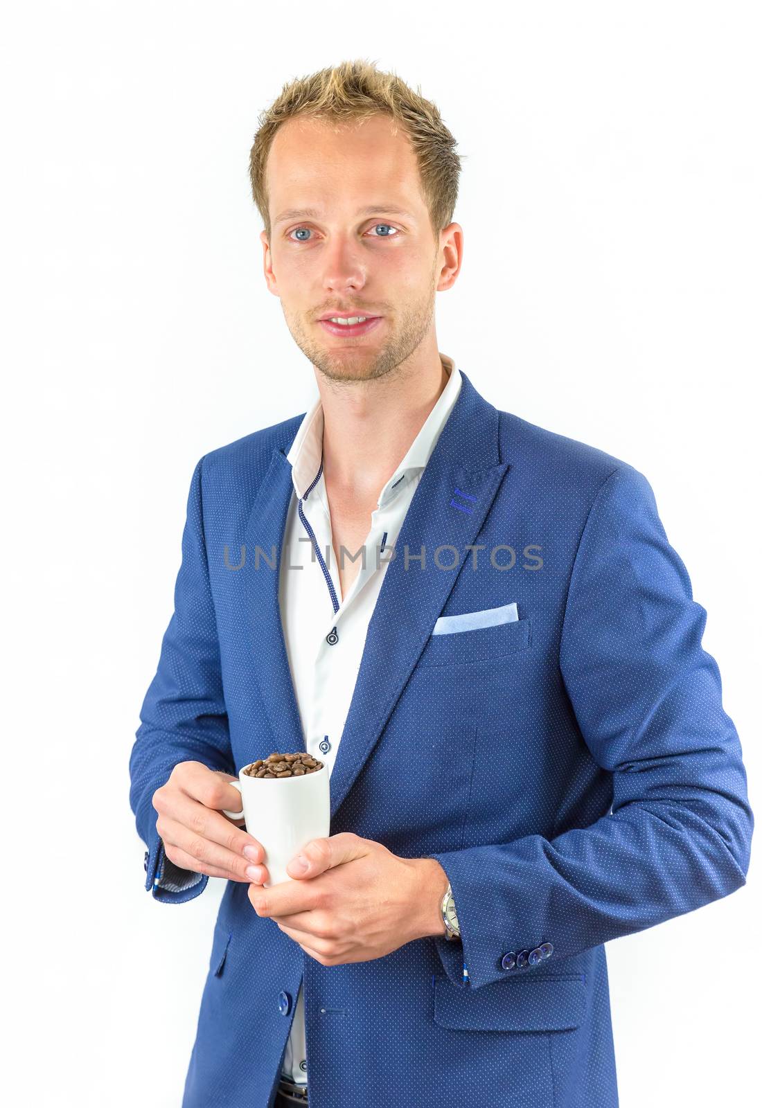 Young salesman promoting coffee beans in cup by BenSchonewille