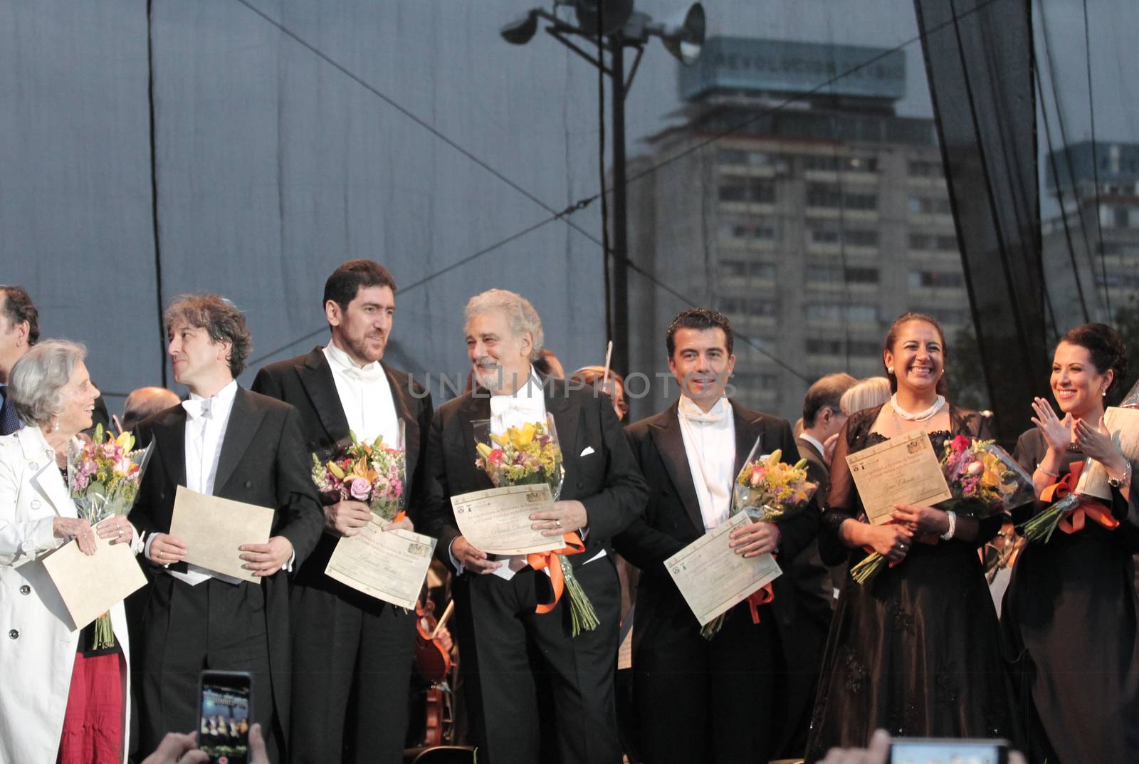 MEXICO, Mexico City: Spanish tenor Placido Domingo (4thL) is seen after a concert with Mexico Philharmonic Orchestra on September 18, 2015 in Mexico City. Soprano Maria Katzarava (R), mezzo-soprano Grace Echauri (2nd R), tenor Dante Alcala (3rd R) and bass Rosendo Flores (3rd L) perfomed Verdi's Requiem in memory of 1985 earthquake.