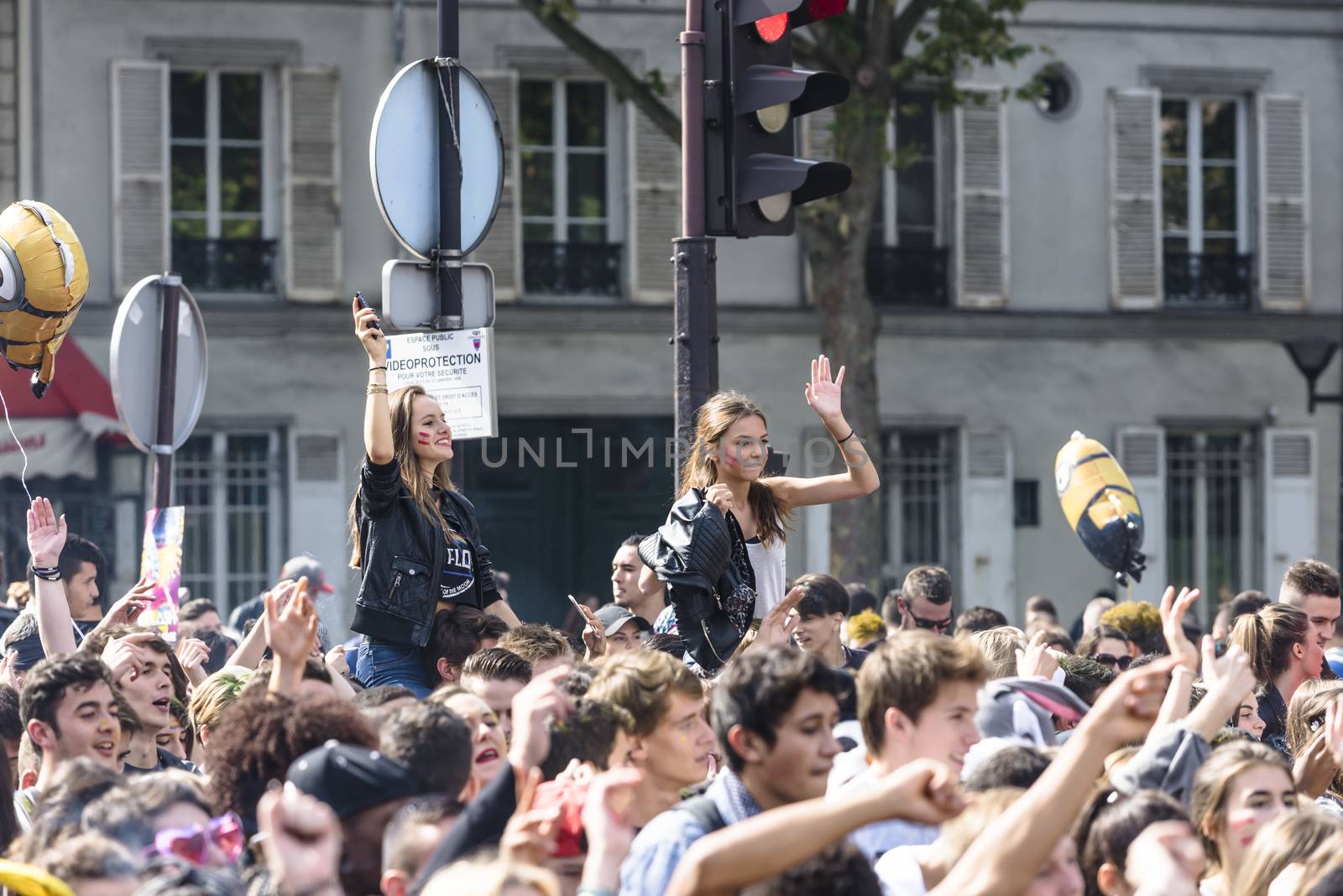 FRANCE, Paris : People dance in the street during the 18th edition of the Techno Parade music event in Paris on September 19, 2015.