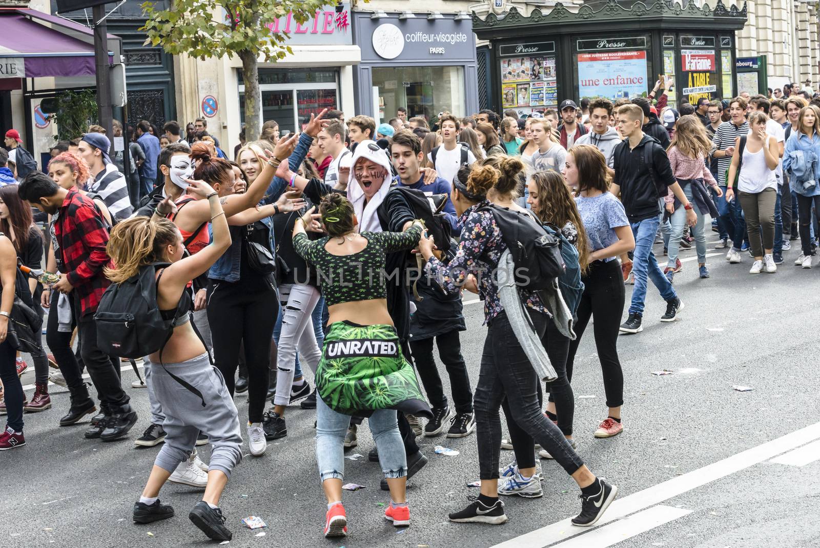 FRANCE, Paris : People dance in the street during the 18th edition of the Techno Parade music event in Paris on September 19, 2015.