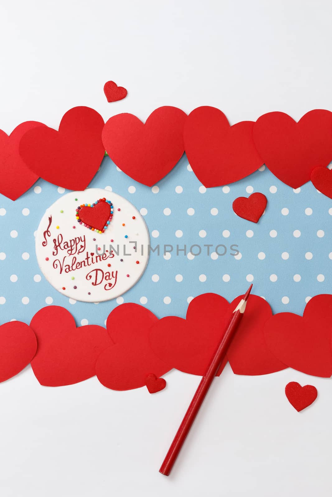 Valentine's day love message, handmade, with pencils and hearts isolated on blue with white dots background (polka dot) with white borders