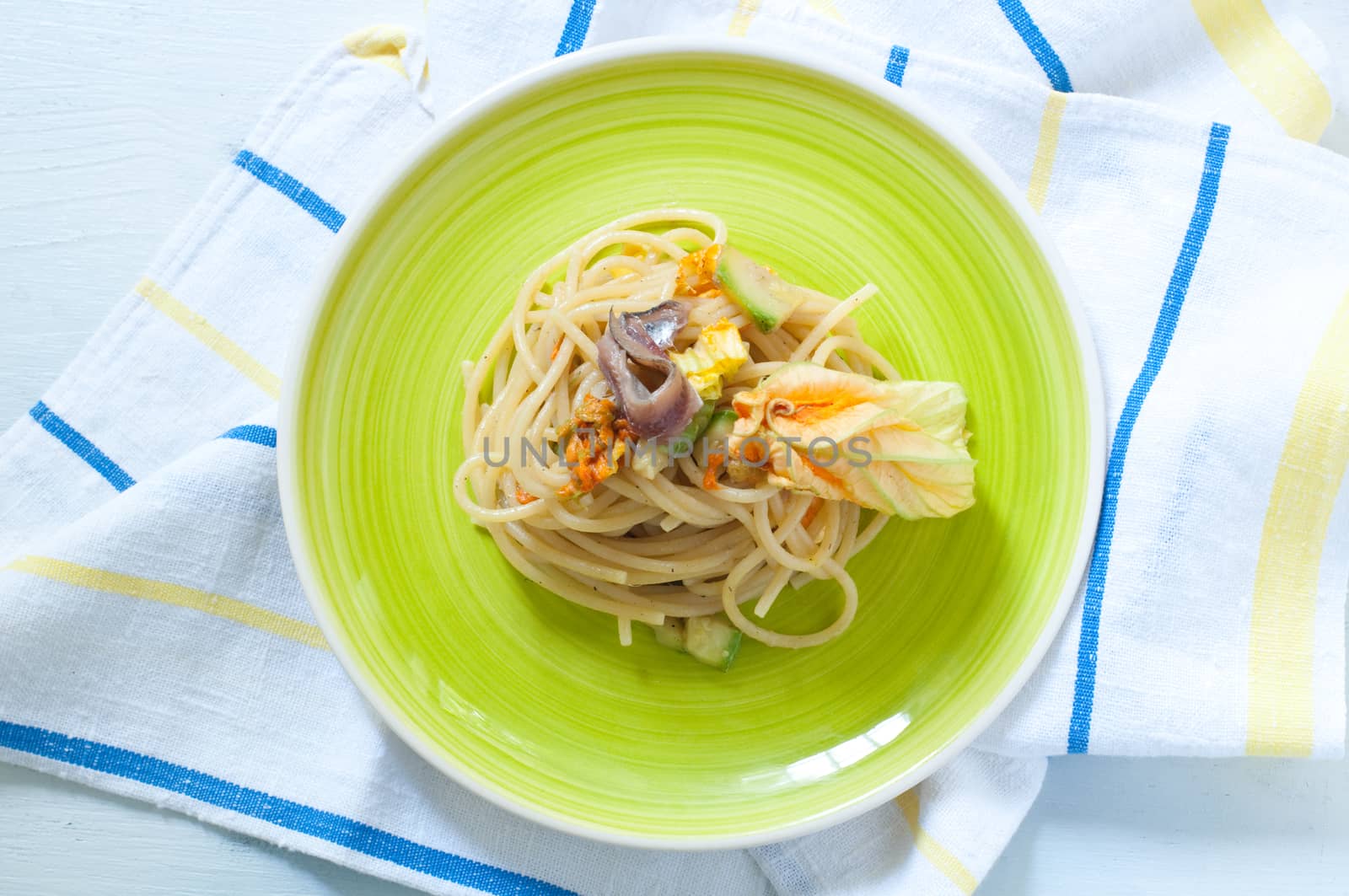 Spaghetti with marinated anchovy, zucchini and zucchini flowers