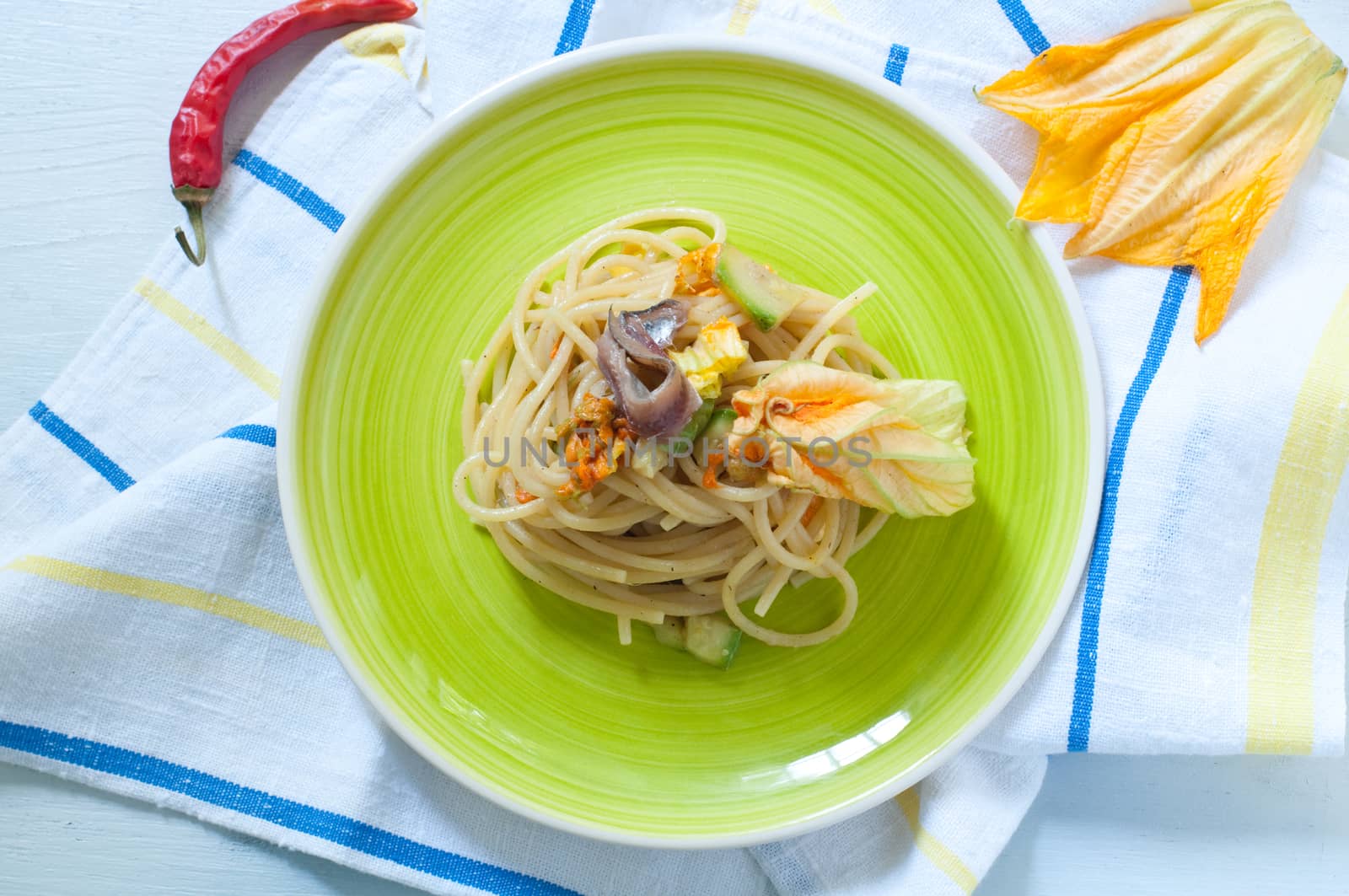 Spaghetti with marinated anchovy, zucchini and zucchini flowers