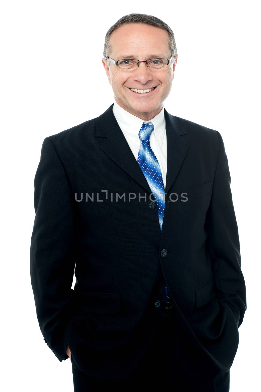 Smiling businessman posing over white by stockyimages