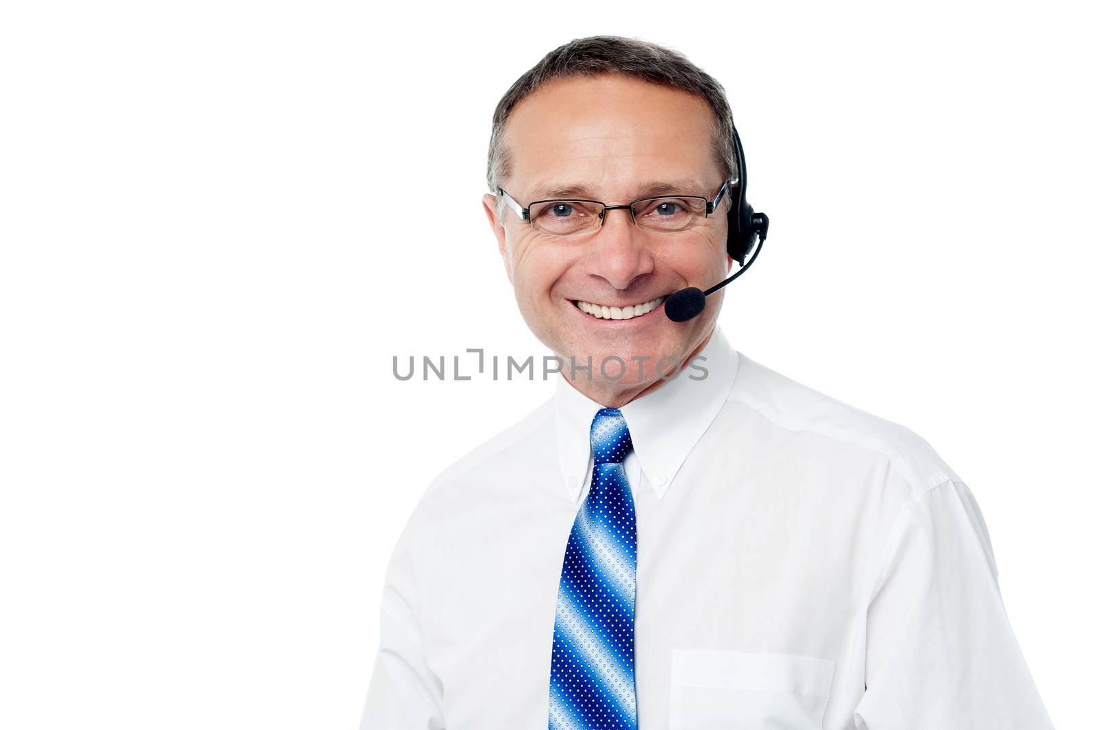 Senior call center executive smiling to camera