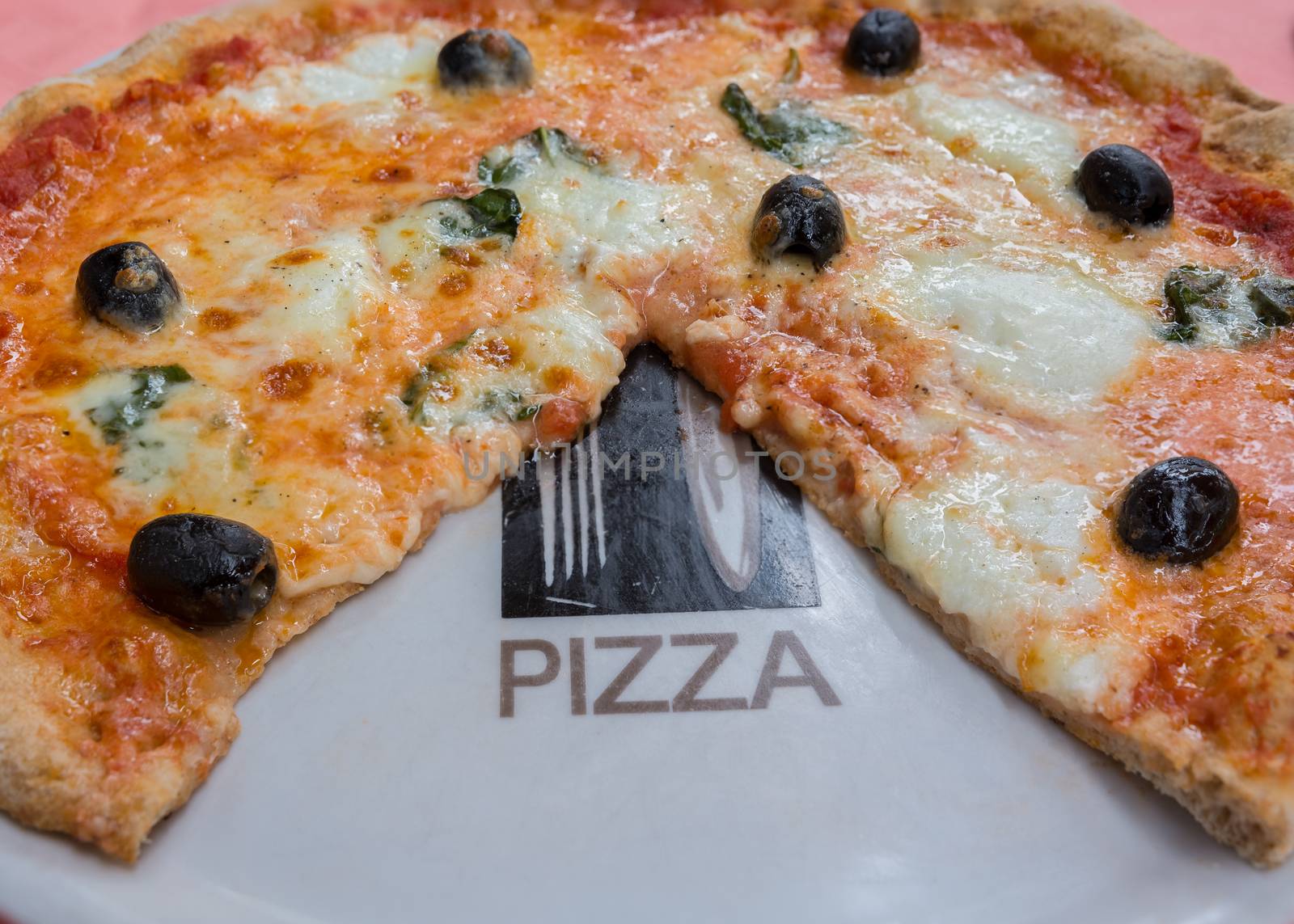 Pictured wheat pizza with olives tomato basil and mozzarella Neapolitan (bufala)