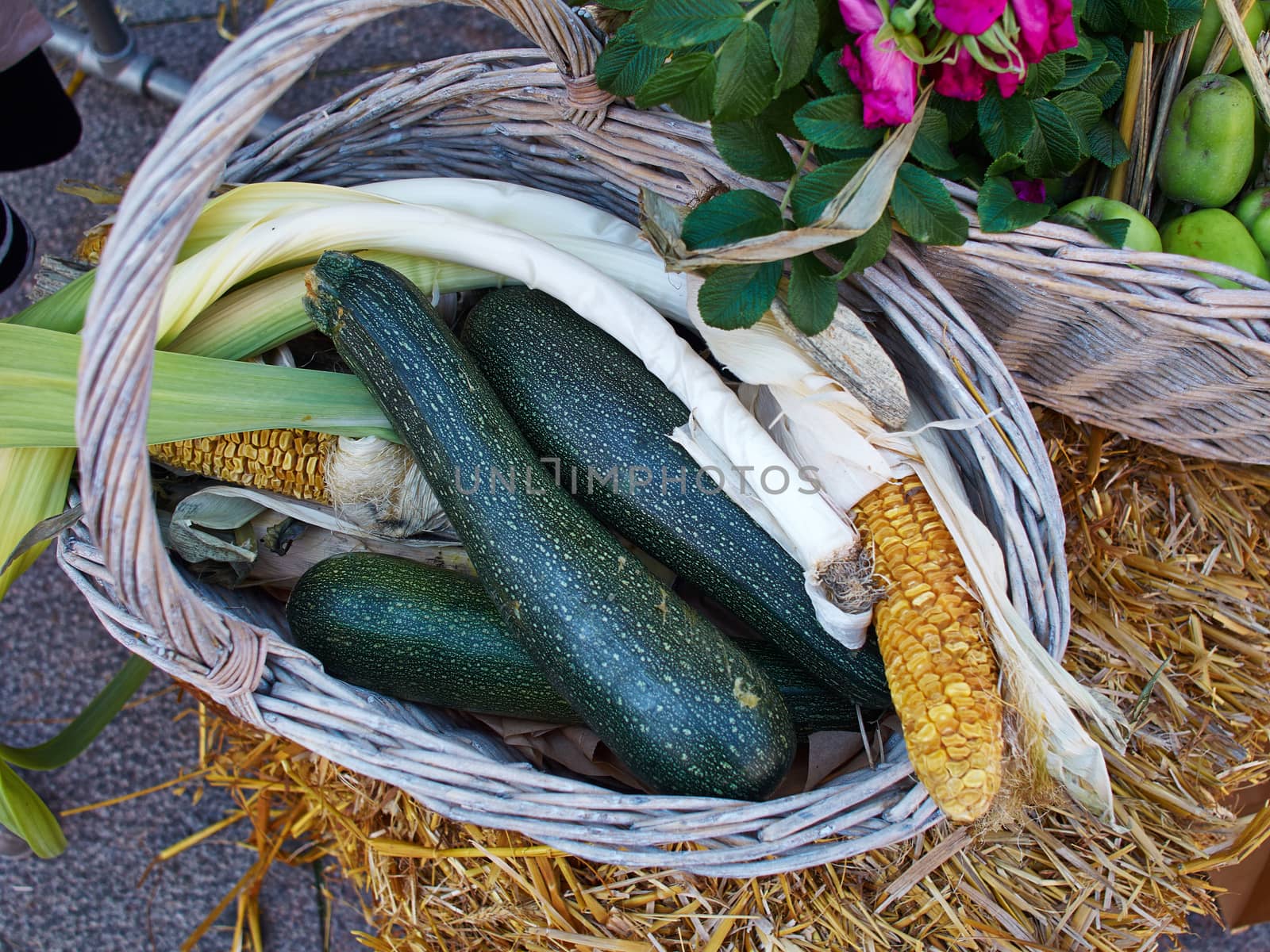 Fresh green zucchini on market display in a basket  