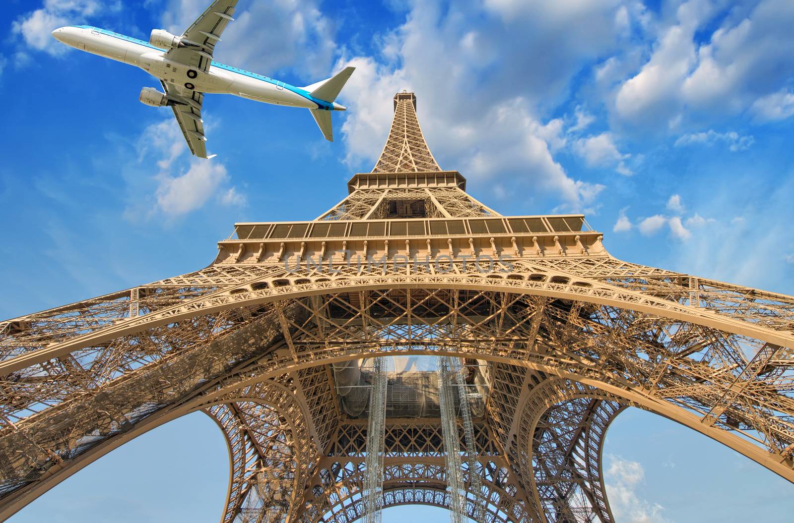 Airplane over Paris, France. Tourism and vacation concept.
