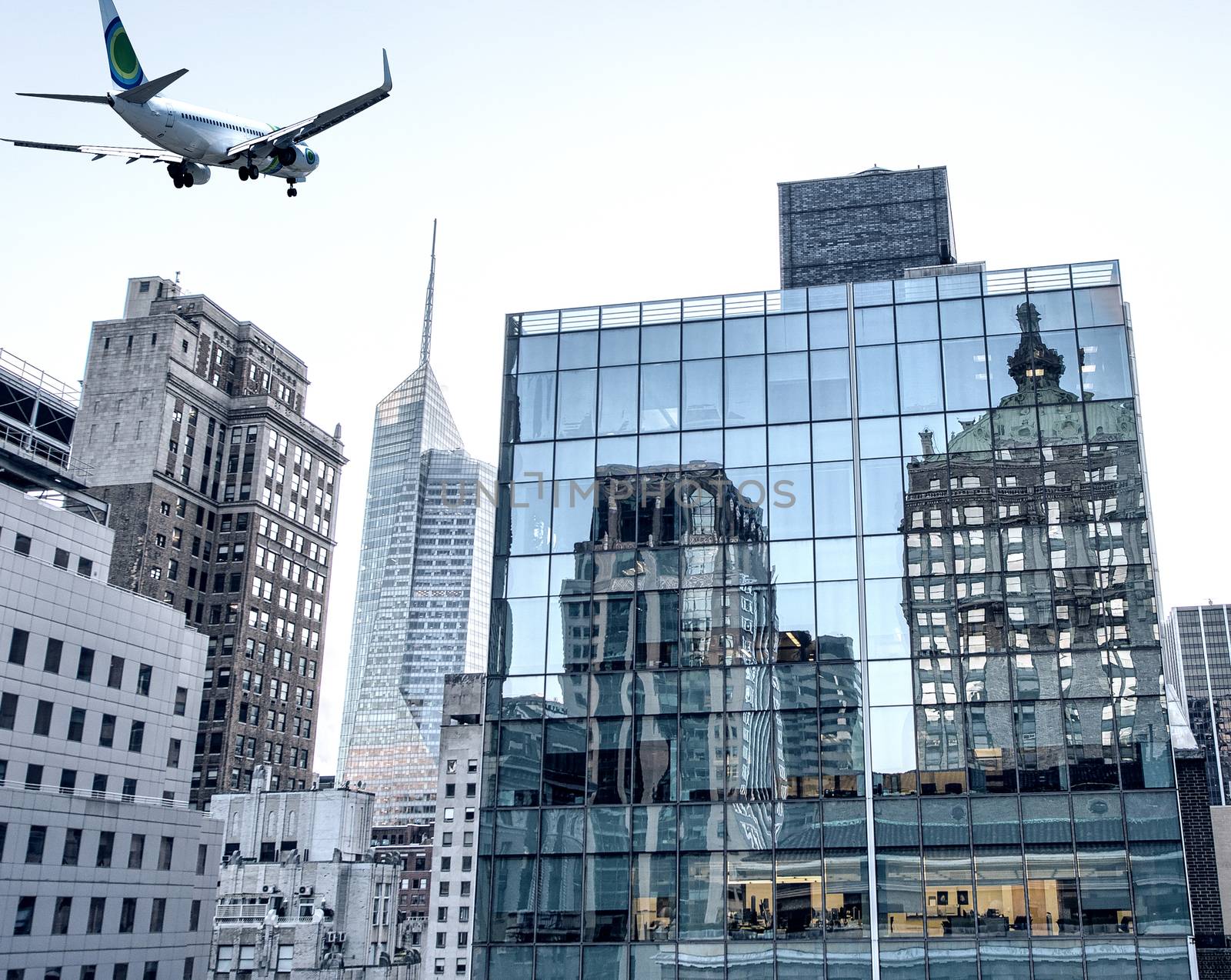 Aircraft overflying New York City skyline.