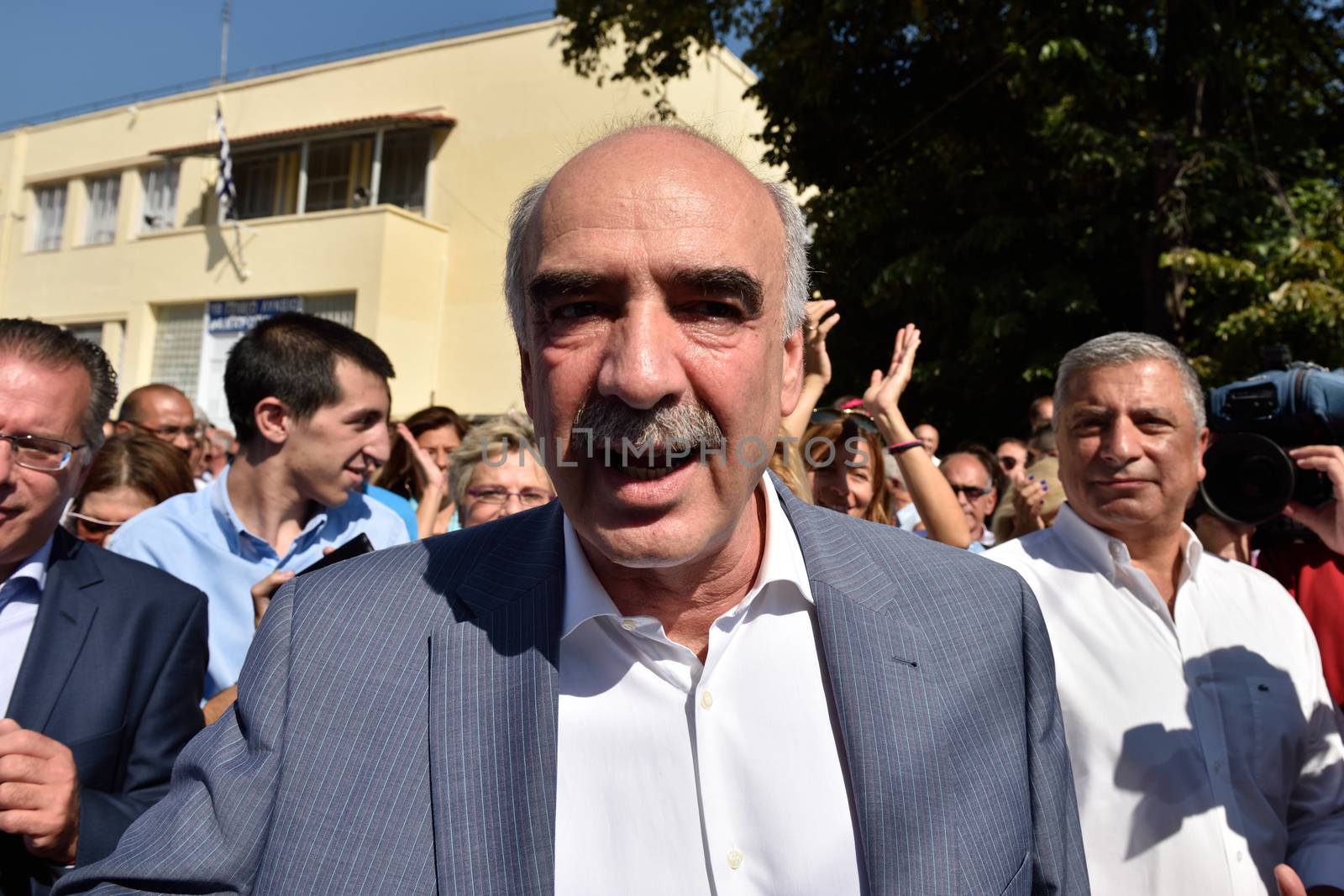 GREECE, Athens: Greece's main right-wing party, led by interim party chief Evangelos Meimarakis casts his vote at a polling station in Maroussi, Athens on September 20, 2015.  Greek voters head to the polls today in a tightly fought general election which is expected to be nail-bitingly close.  After just seven months of power, Alexis Tsipras called these snap elections to win a new mandate to implement Greece's new bailout plan. Meimarakis' party has been the main opposition party since losing power in January. 