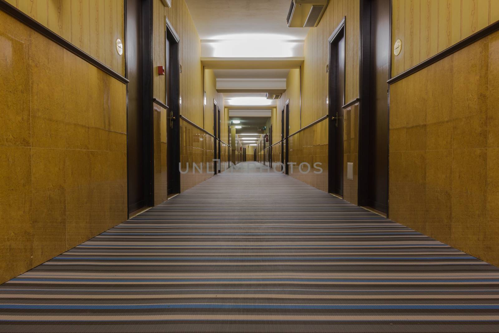 Corridor view of a new Italian hotel .