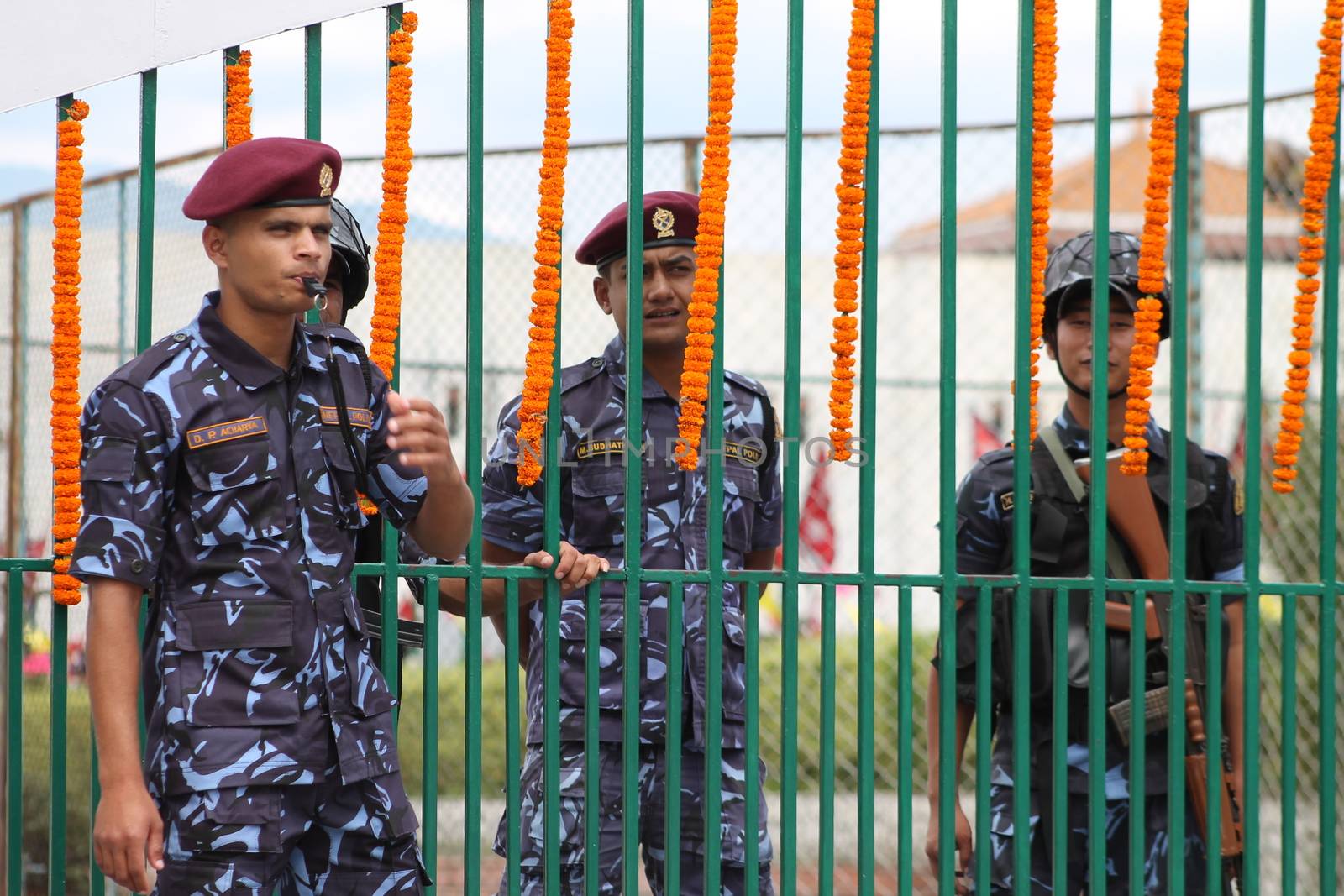 NEPAL, Kathmandu: A soldier blows in his whistle as Nepal celebrates a new constitution embracing the principles of republicanism, federalism, secularism, and inclusiveness, in Kathmandu on September 20, 2015. Out of the 598 members of the Constituent Assembly, 507 voted for the new constitution, 25 voted against, and 66 abstained in a vote on September 16, 2015. The event was marked with protests organized by parties of the Tharu and Madhesi ethnic communities, which according to Newzulu contributor Anish Gujarel led to violence in Southern Nepal.