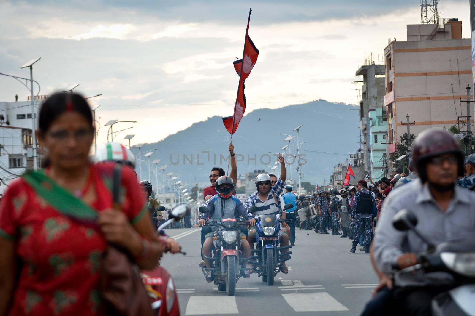 NEPAL, Kathmandu: After years of debate, Nepal adopted a new constitution on September 20, 2015, prompting scores of residents to celebrate near the constituent assembly building in Kathmandu. Out of the 598 members of the Constituent Assembly, 507 voted for the new constitution, 25 voted against, and 66 abstained in a vote on September 16, 2015. The event was marked with protests organized by parties of the Tharu and Madhesi ethnic communities, which according to Newzulu contributor Anish Gujarel led to violence in Southern Nepal.