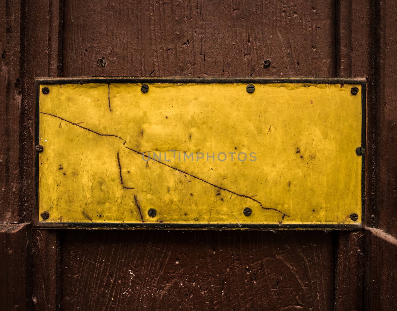 A Grungy Yellow Sign On A Wooden Door For Your Text
