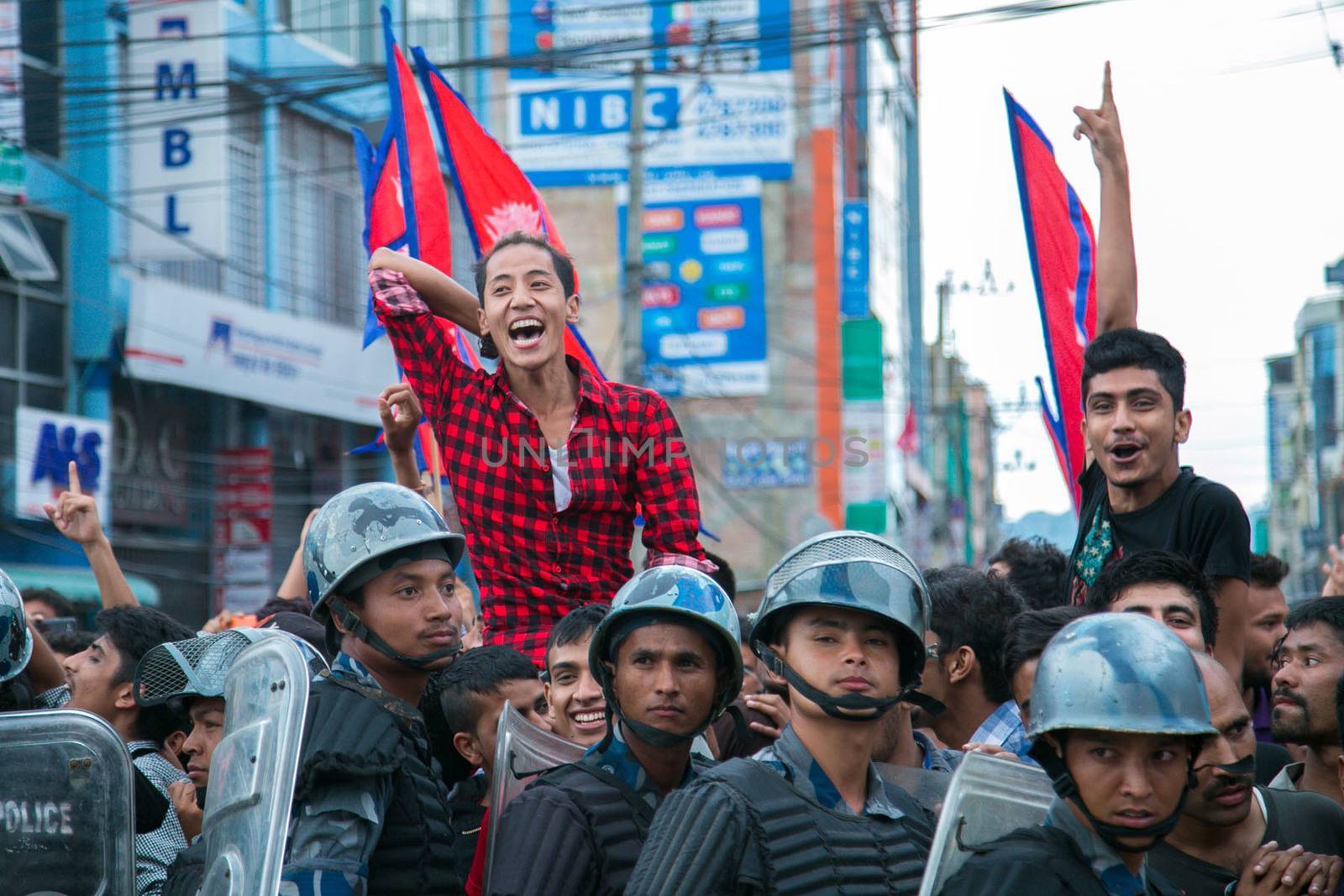 NEPAL, Kathmandu: After years of debate, Nepal adopted a new constitution on September 20, 2015, prompting scores of residents to celebrate near the constituent assembly building in Kathmandu. Out of the 598 members of the Constituent Assembly, 507 voted for the new constitution, 25 voted against, and 66 abstained in a vote on September 16, 2015. The event was marked with fireworks and festivities, but also with protests organized by parties of the Tharu and Madhesi ethnic communities.