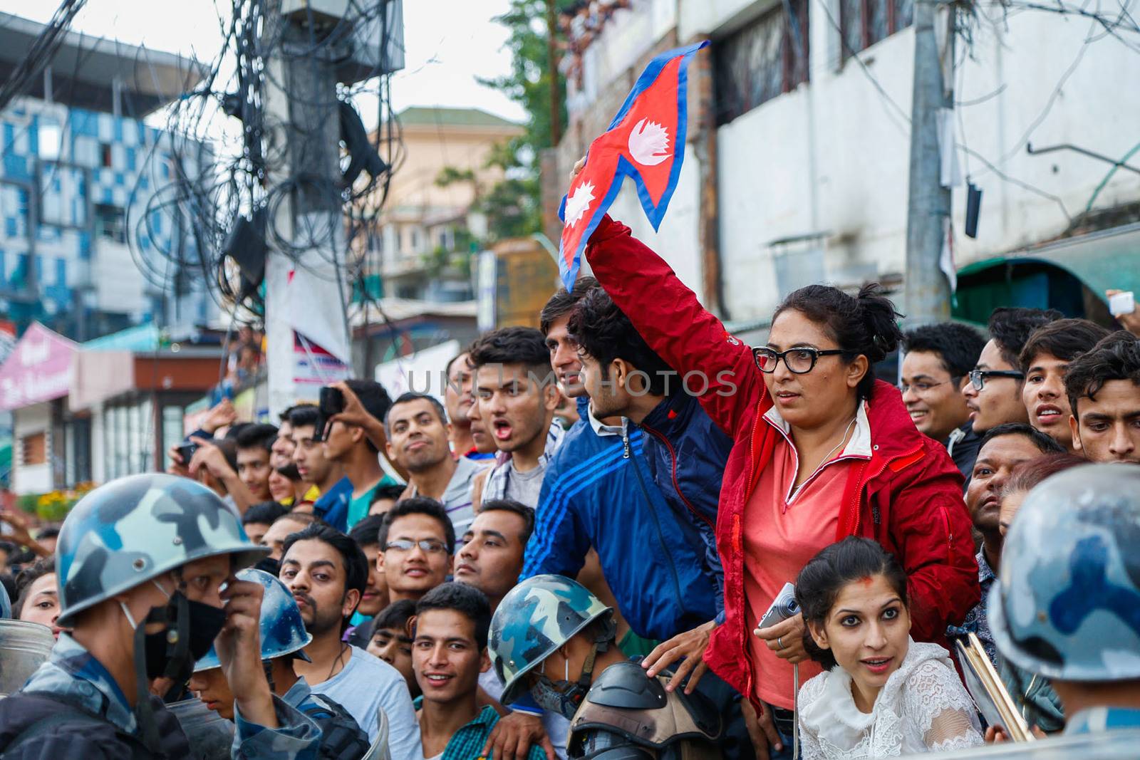 NEPAL, Kathmandu: After years of debate, Nepal adopted a new constitution on September 20, 2015, prompting scores of residents to celebrate near the constituent assembly building in Kathmandu. Out of the 598 members of the Constituent Assembly, 507 voted for the new constitution, 25 voted against, and 66 abstained in a vote on September 16, 2015. The event was marked with fireworks and festivities, but also with protests organized by parties of the Tharu and Madhesi ethnic communities.