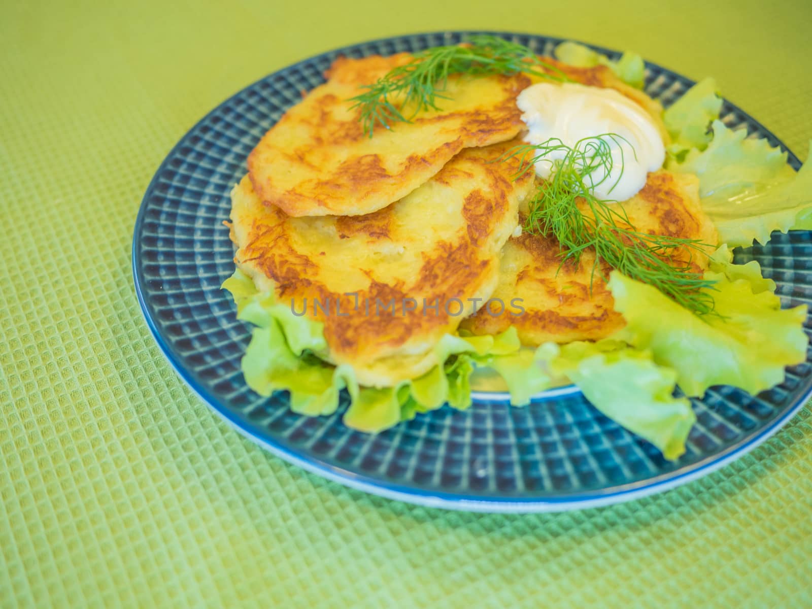potato pankakes with cream frache and dill - draniki
