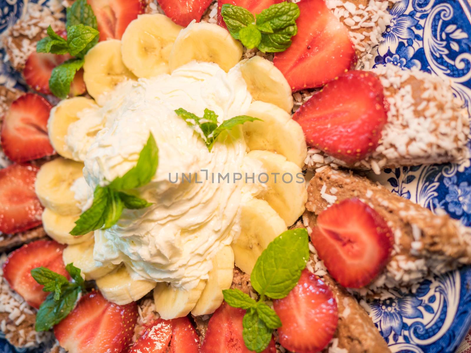 Chocolate dessert with banana and strawberry under whipped cream by dolfinvik