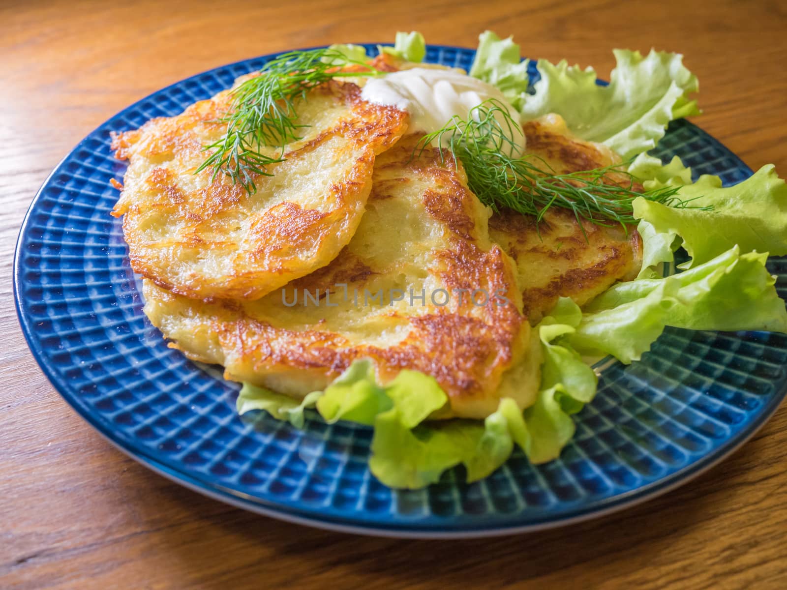 potato pankakes with cream frache and dill - draniki