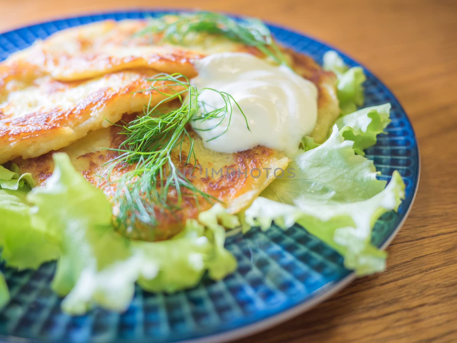 potato pankakes with cream frache and dill - draniki