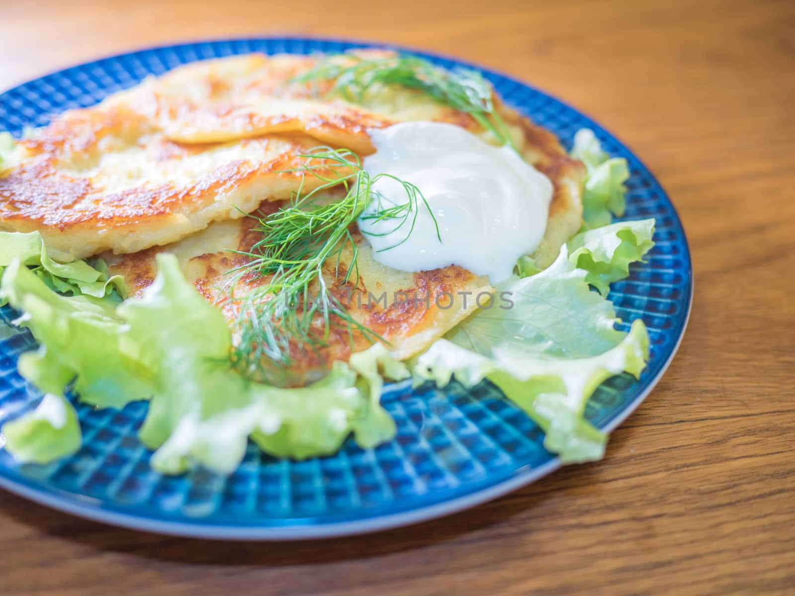 potato pankakes with cream frache and dill - draniki