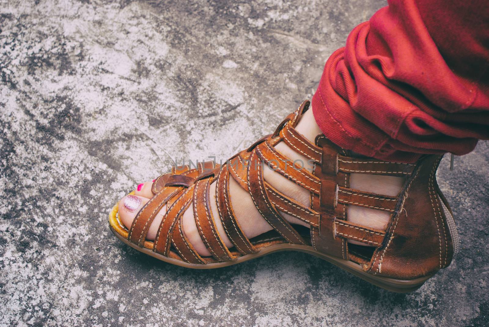 Photograph of a womans foot with a sandal