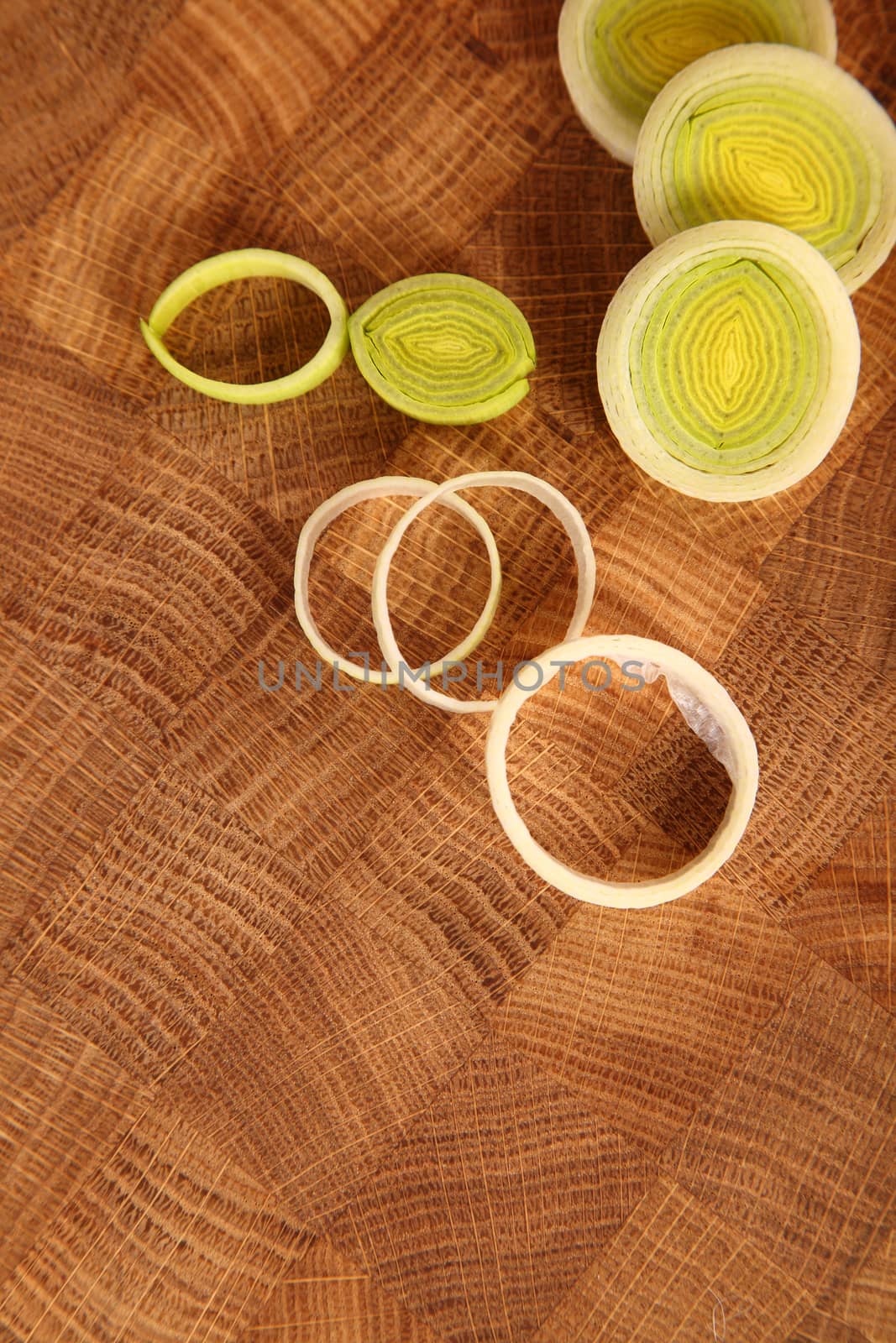 The leek cut by circles on a chopping board