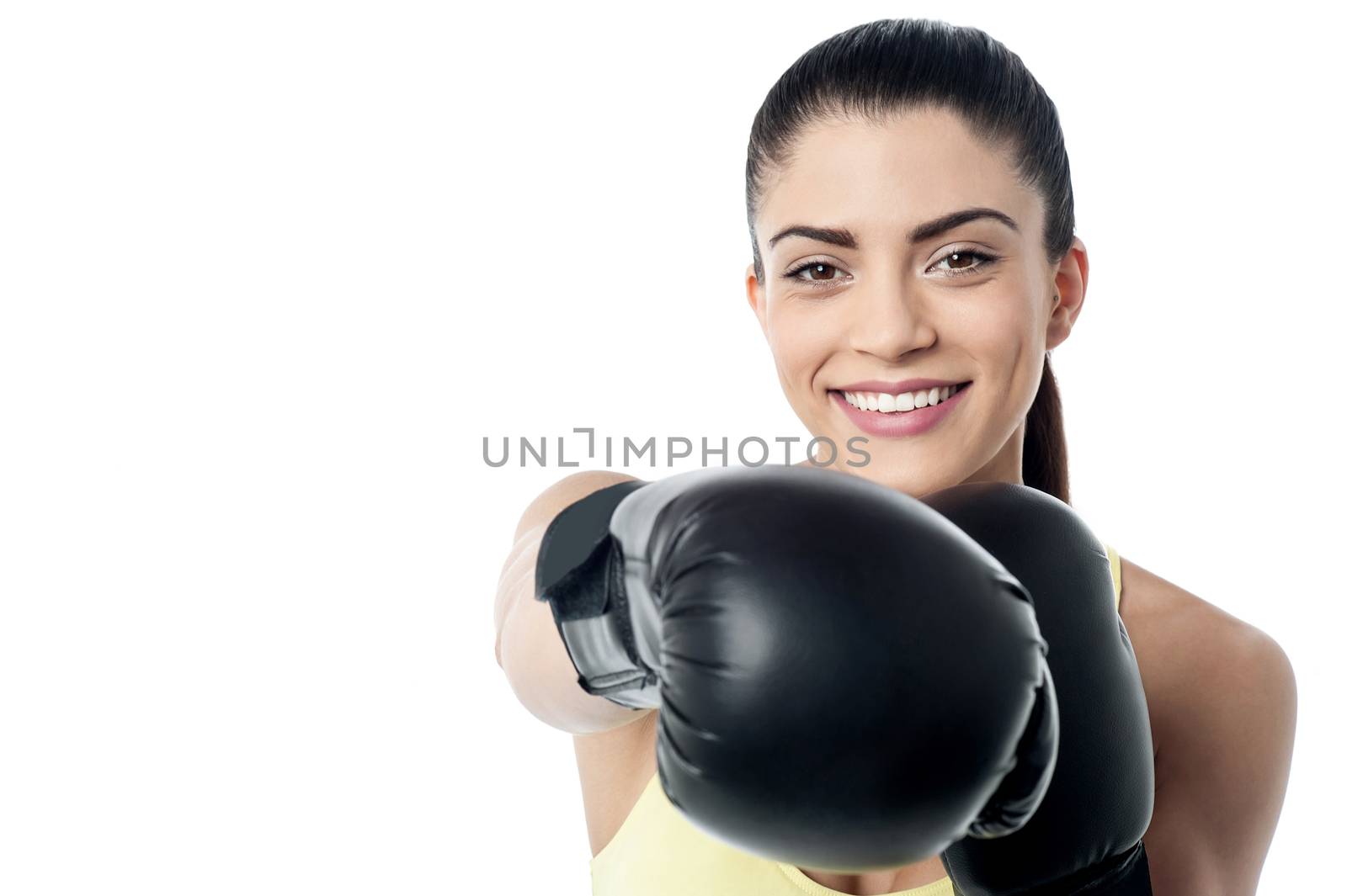 Fit woman ready to fight with boxing gloves